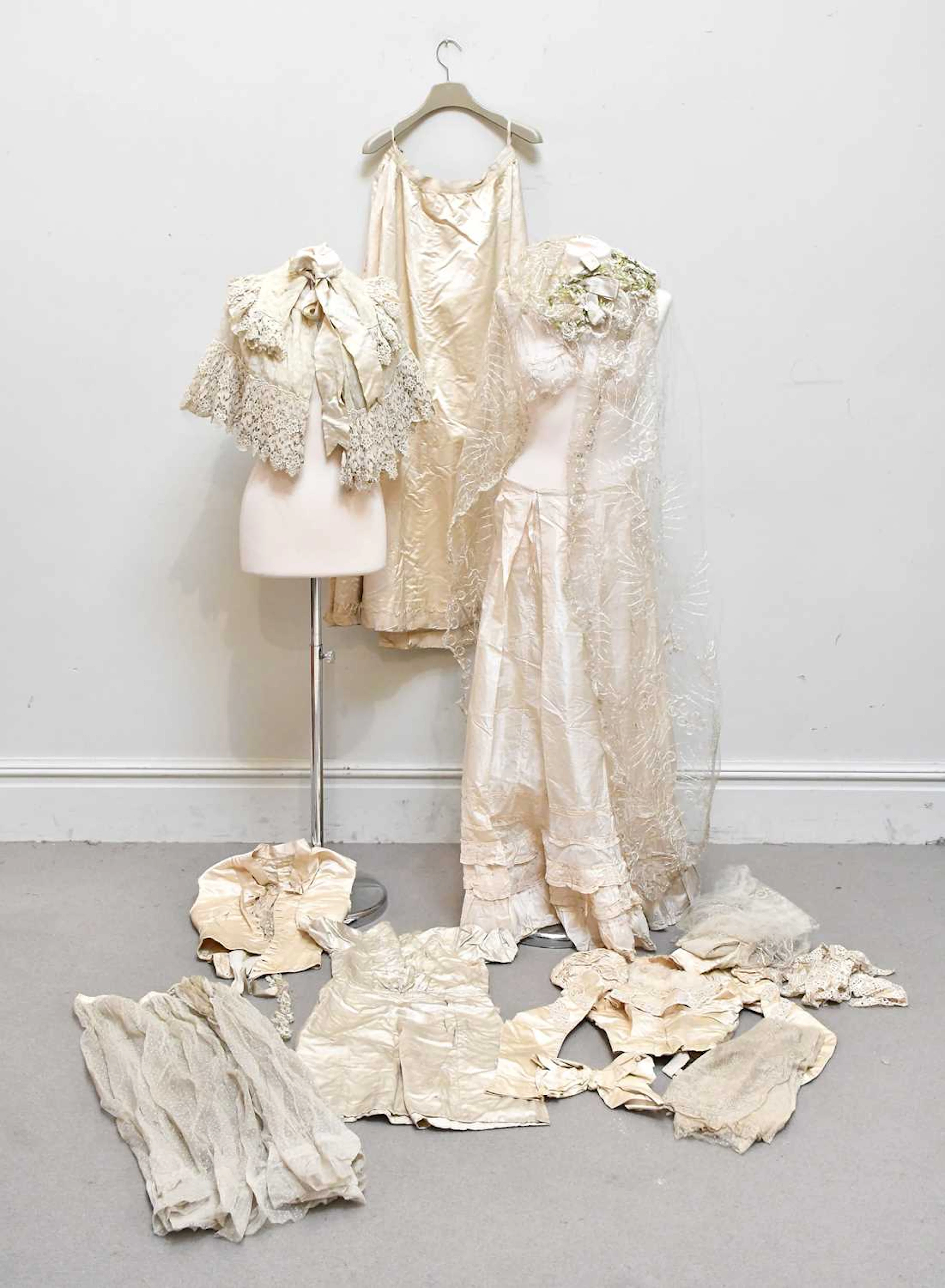A Victorian late 19th century cream satin long skirt