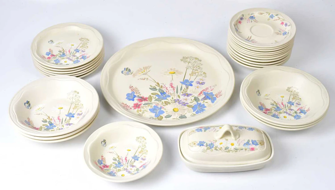 POOLE POTTERY; a 'Springtime' part dinner and tea service comprising teapot