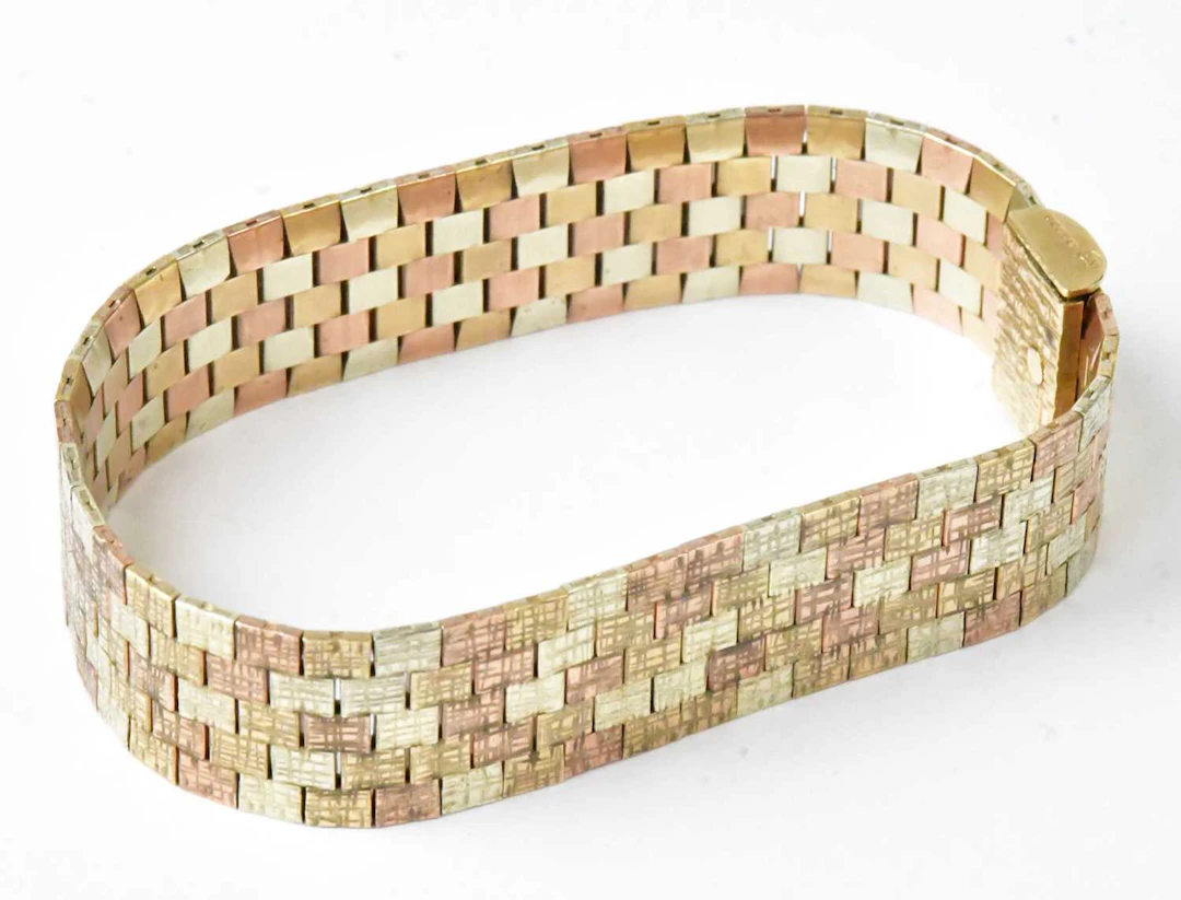 A 9ct tri-colour gold bark-effect brick link bracelet
