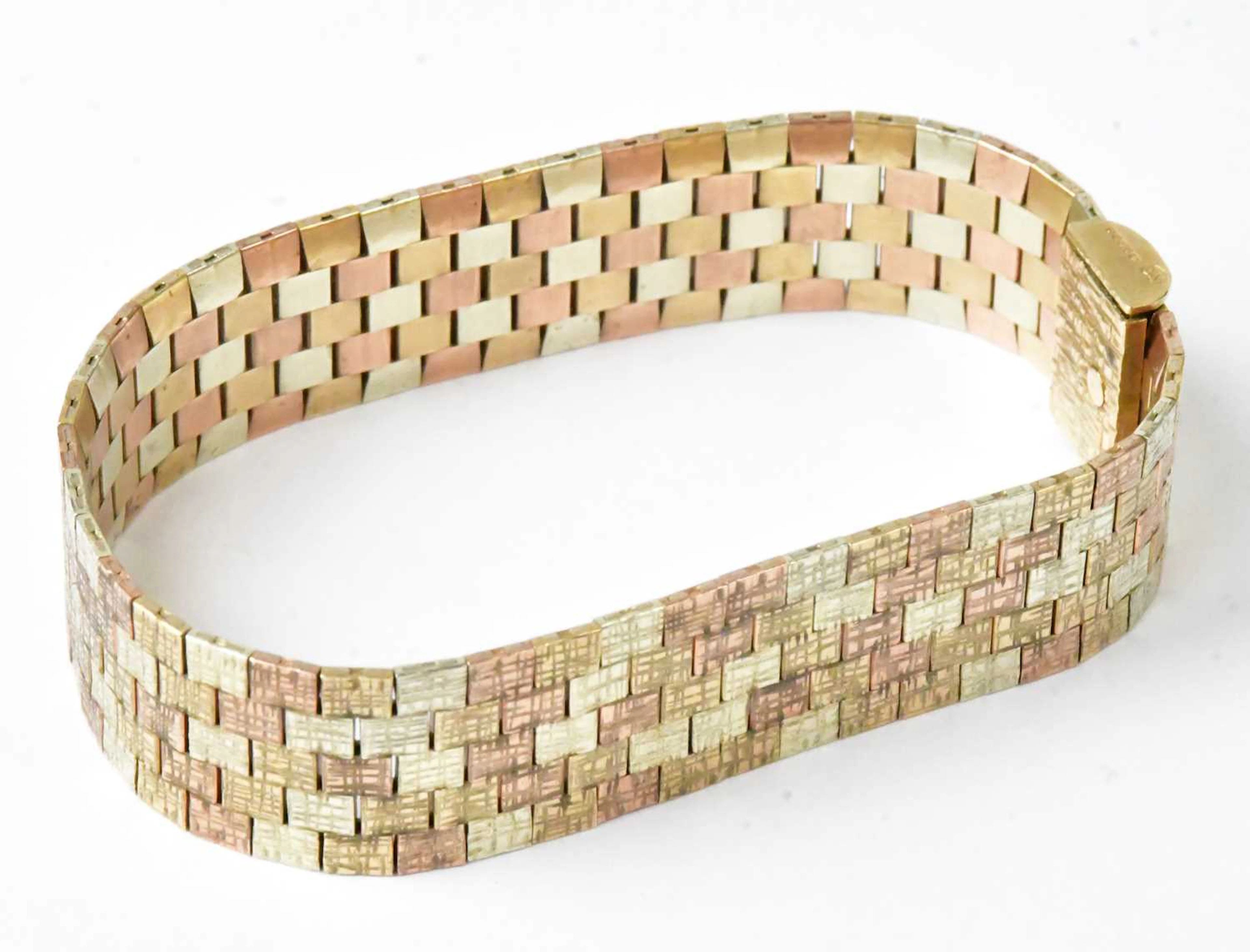 A 9ct tri-colour gold bark-effect brick link bracelet