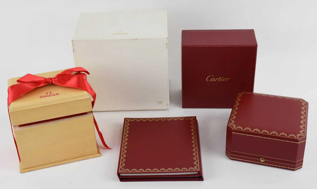 Two empty designer wristwatch boxes