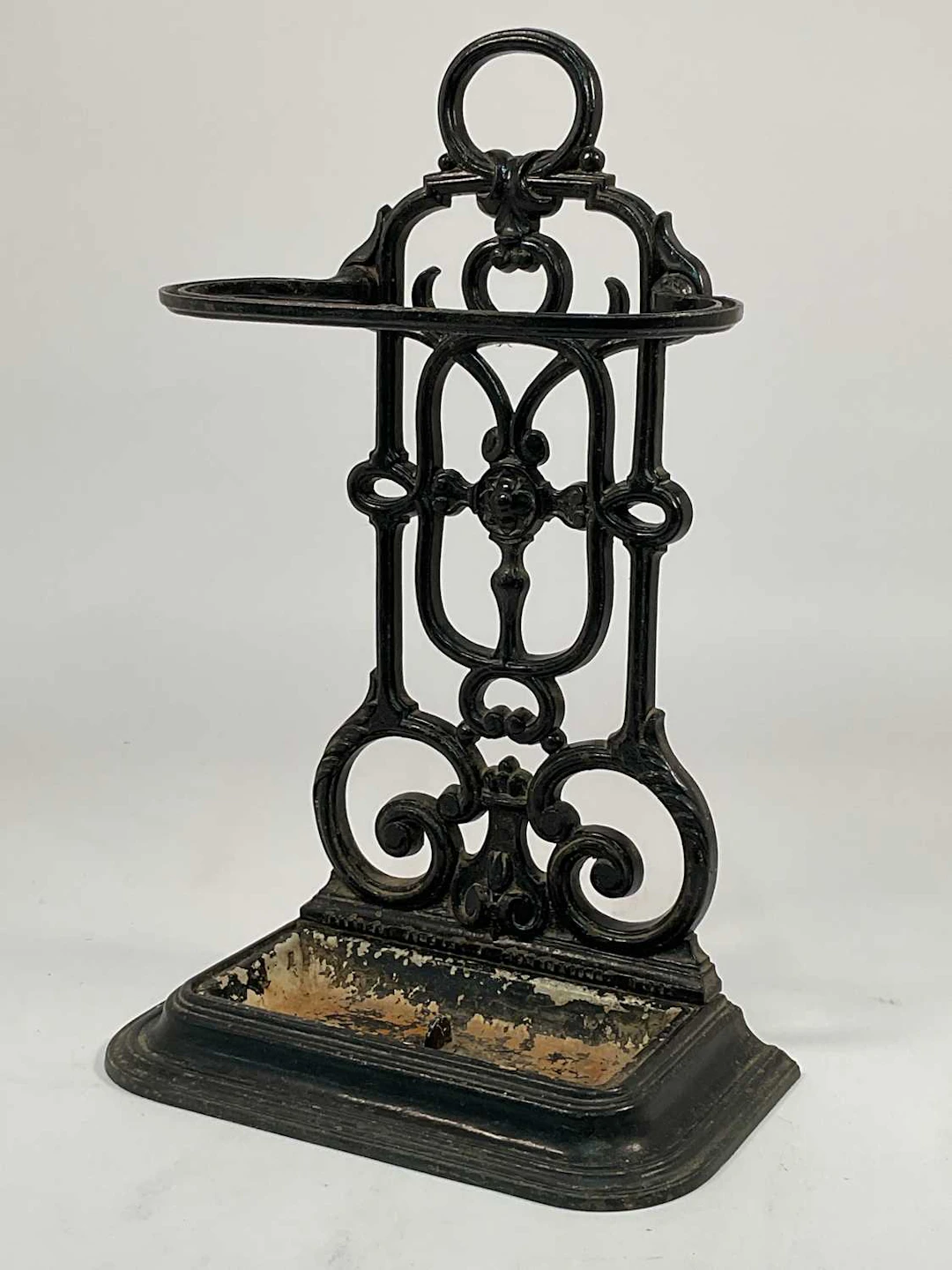 A cast iron umbrella and walking stick stand