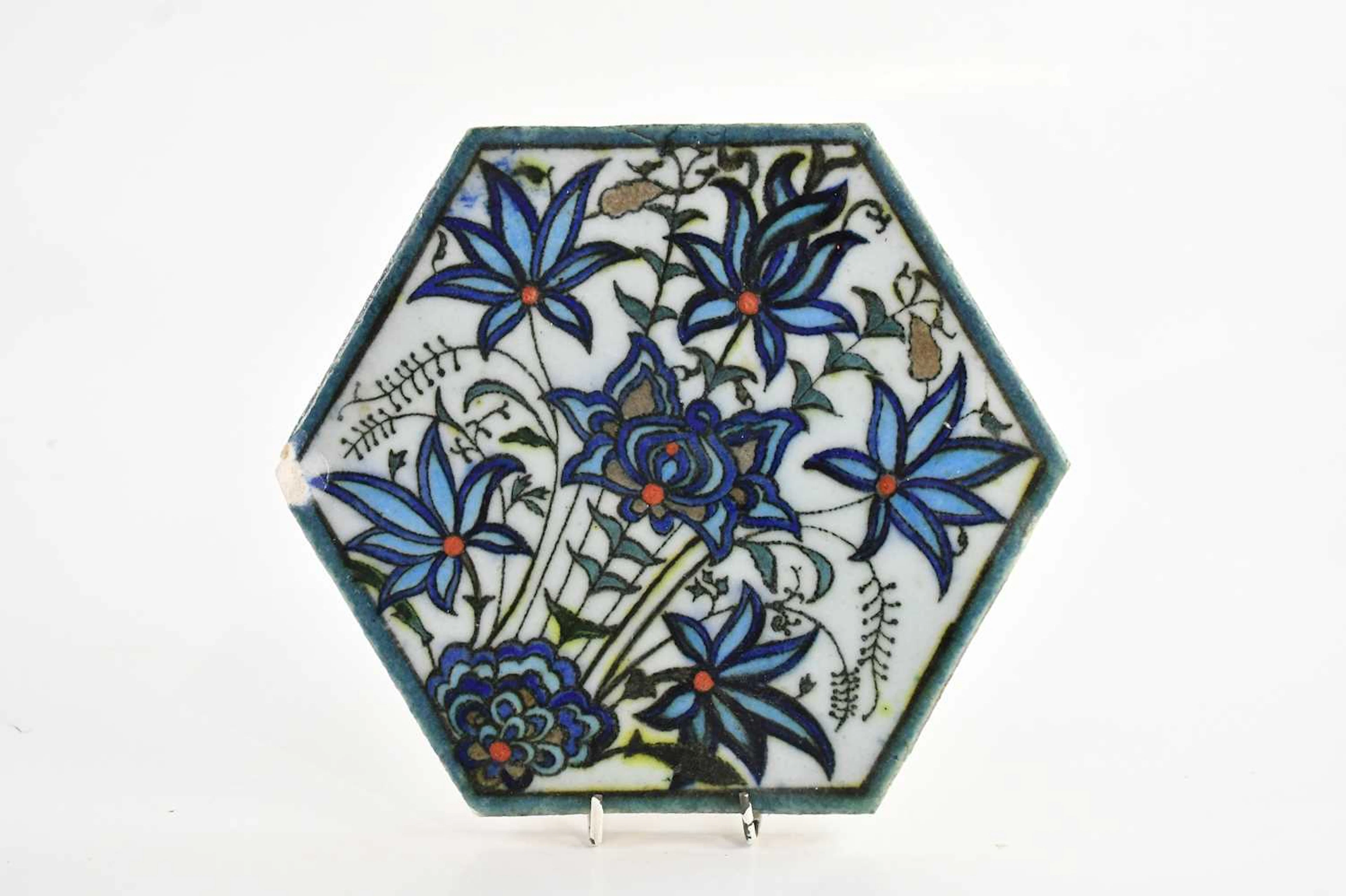 An Iznik hexagonal tile with floral decoration