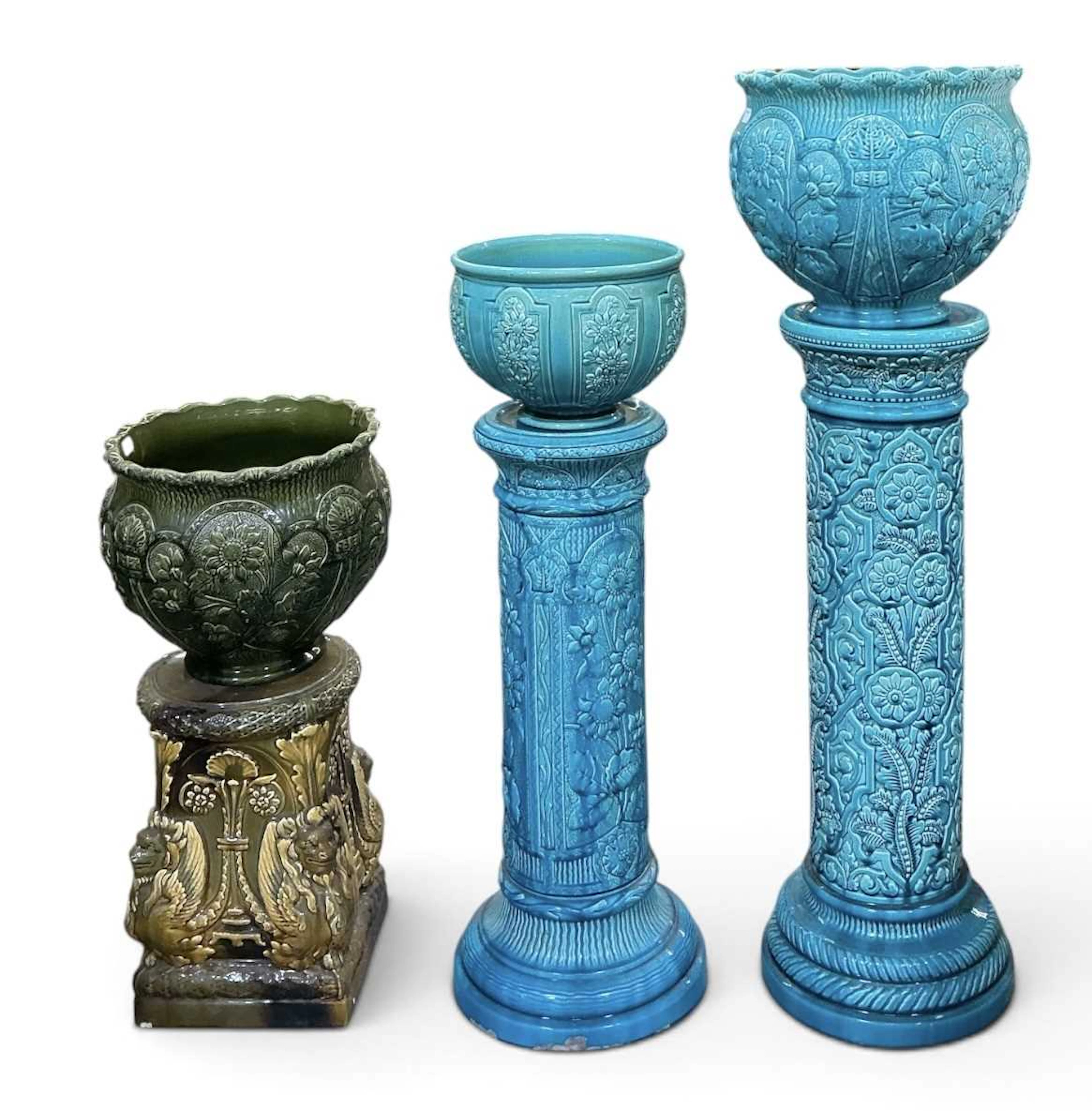 Two early 20th century turquoise glazed majolica jardinières on stand