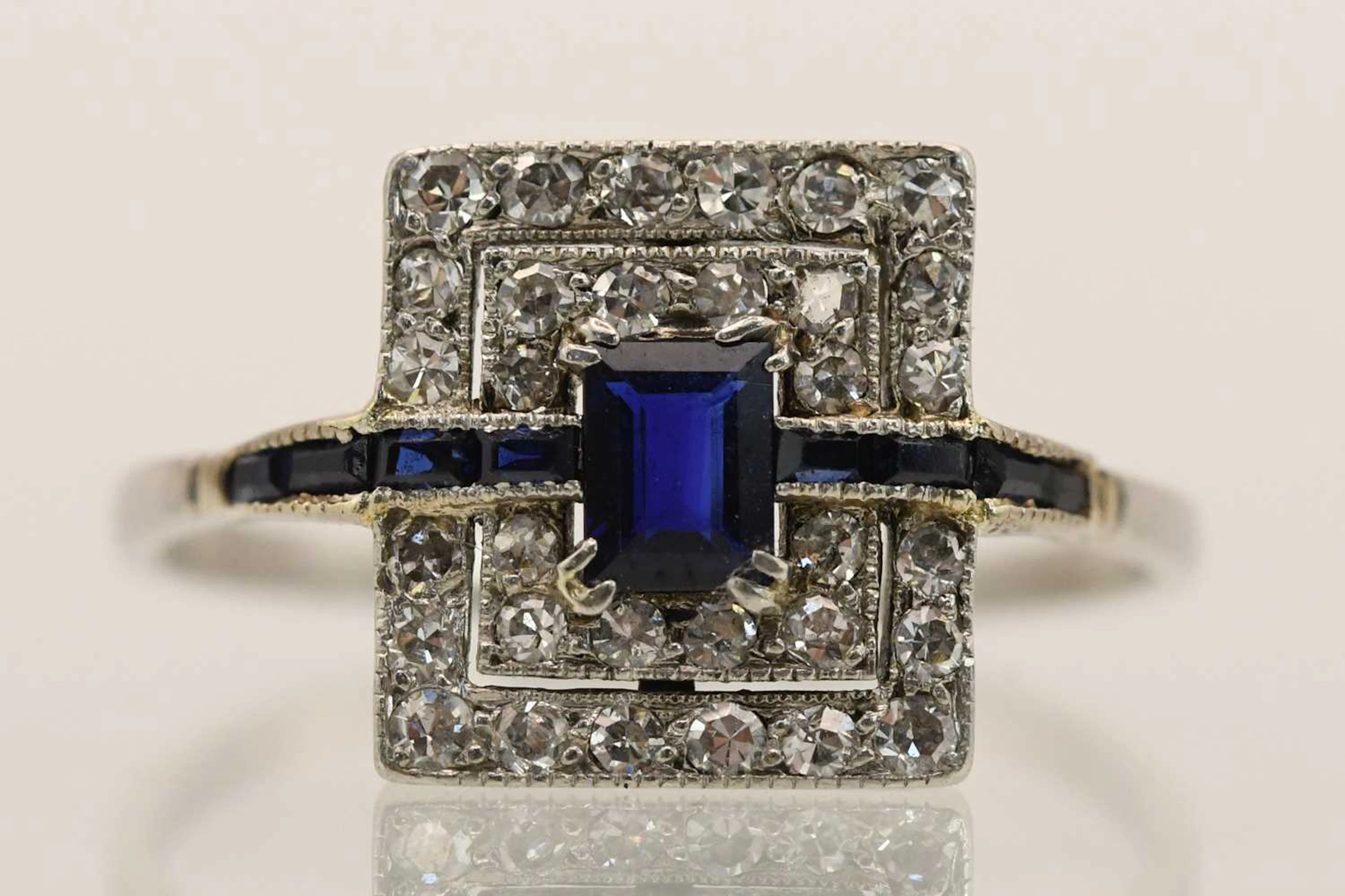 An Art Deco platinum sapphire and diamond set dress ring