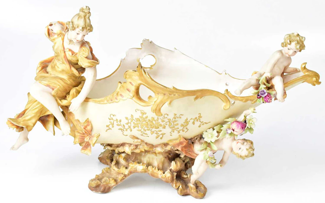 A blush ivory figural bowl