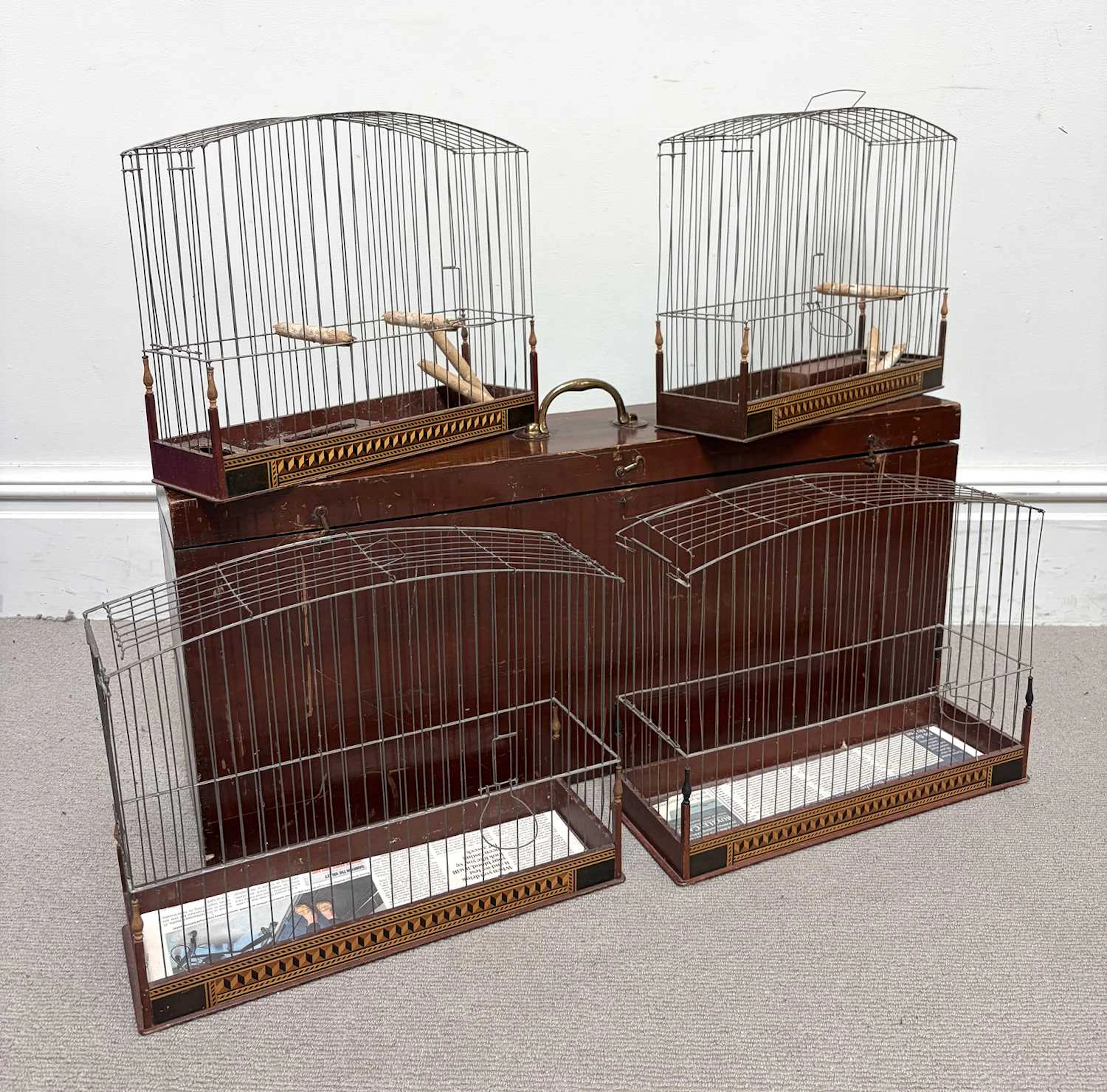 A set of four early 20th century bird cages