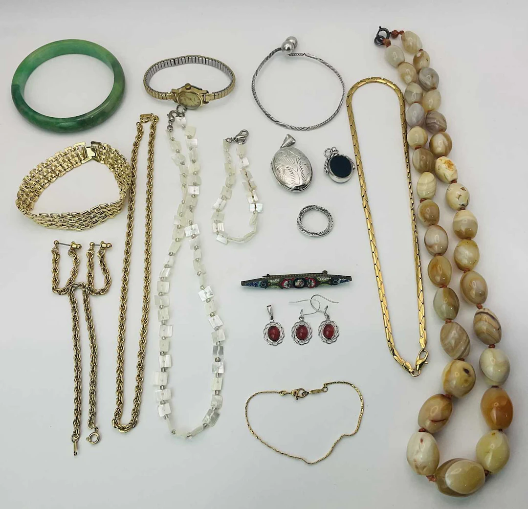 A quantity of costume jewellery to include a silver locket