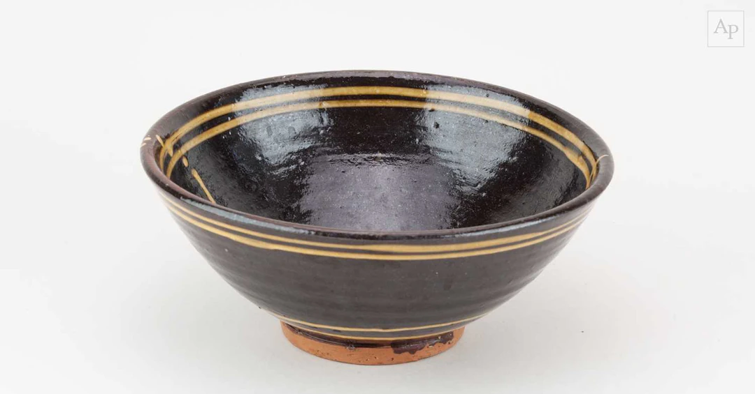 CLIVE BOWEN (born 1943); a slipware bowl with trailed...