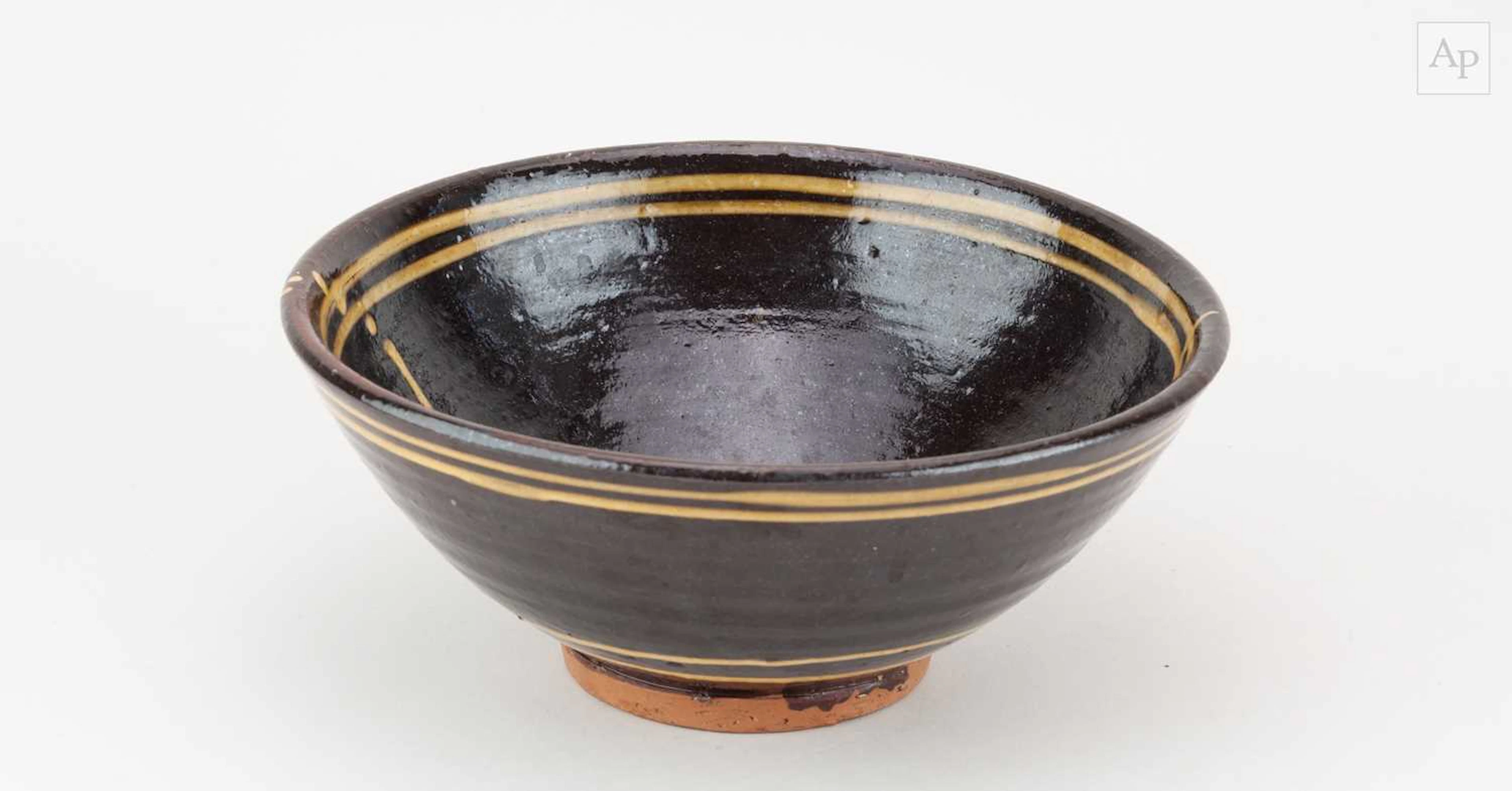 CLIVE BOWEN (born 1943); a slipware bowl with trailed...