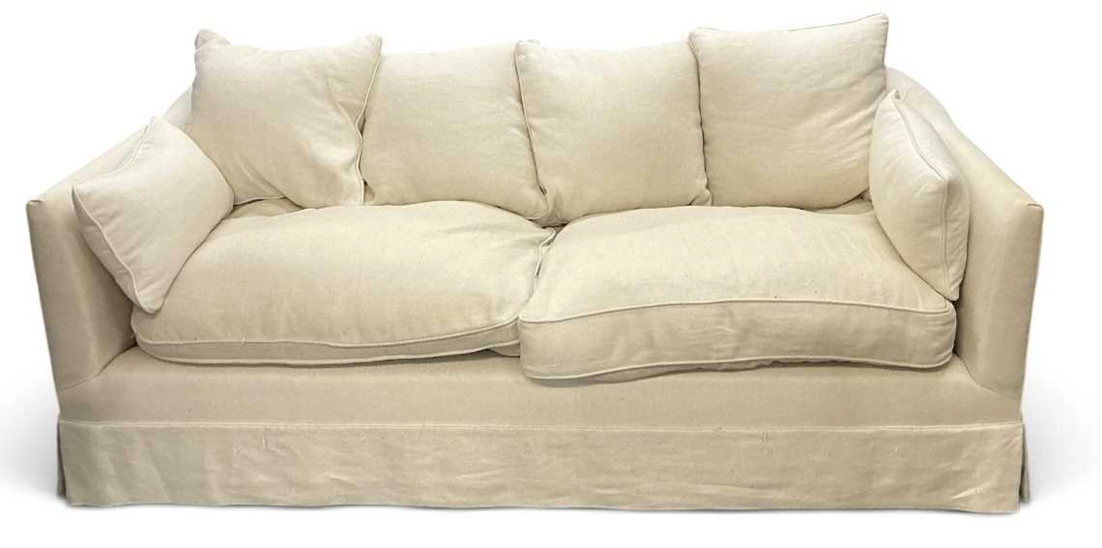 A large modern contemporary white upholstered two seater sofa