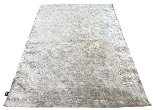 CARPET COUTURE ITALIA; a modern Mystic beige ground woollen machine made carpet
