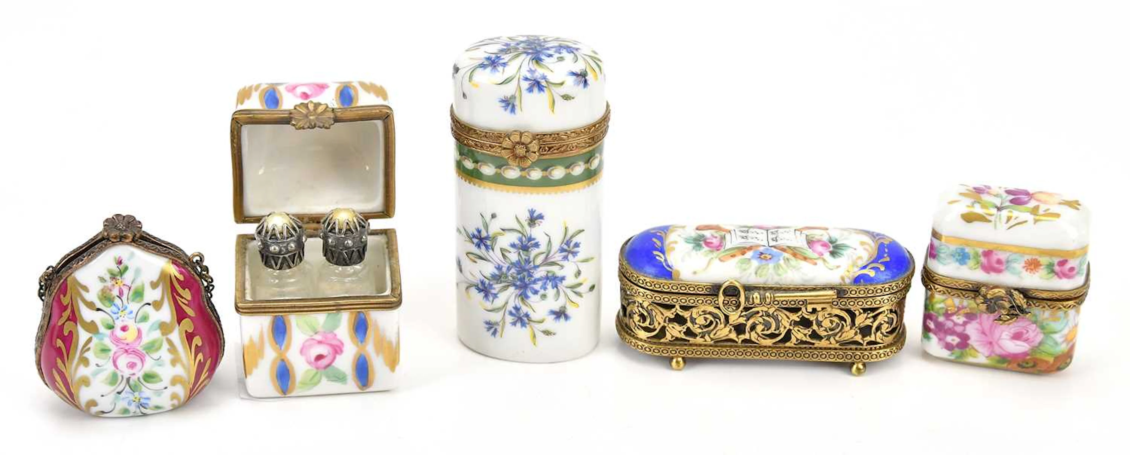 A collection of porcelain hand painted trinket boxes