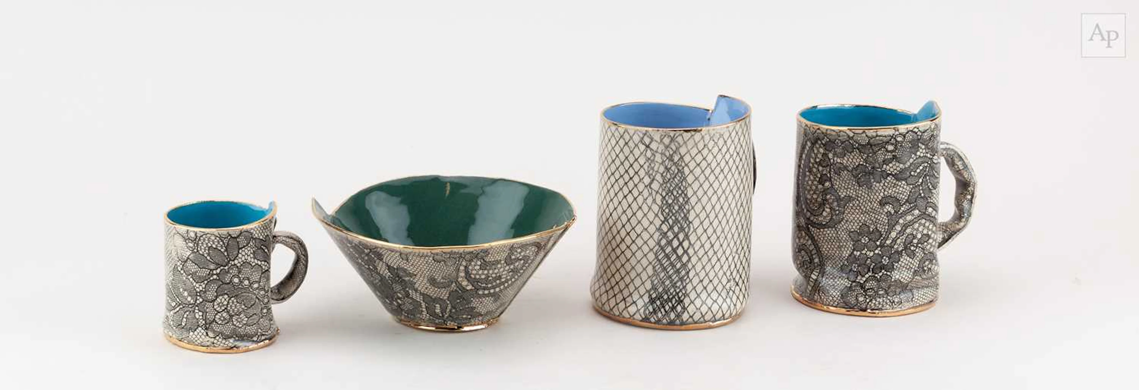 VANESSA CONYERS; a pair of earthenware mugs decorated...