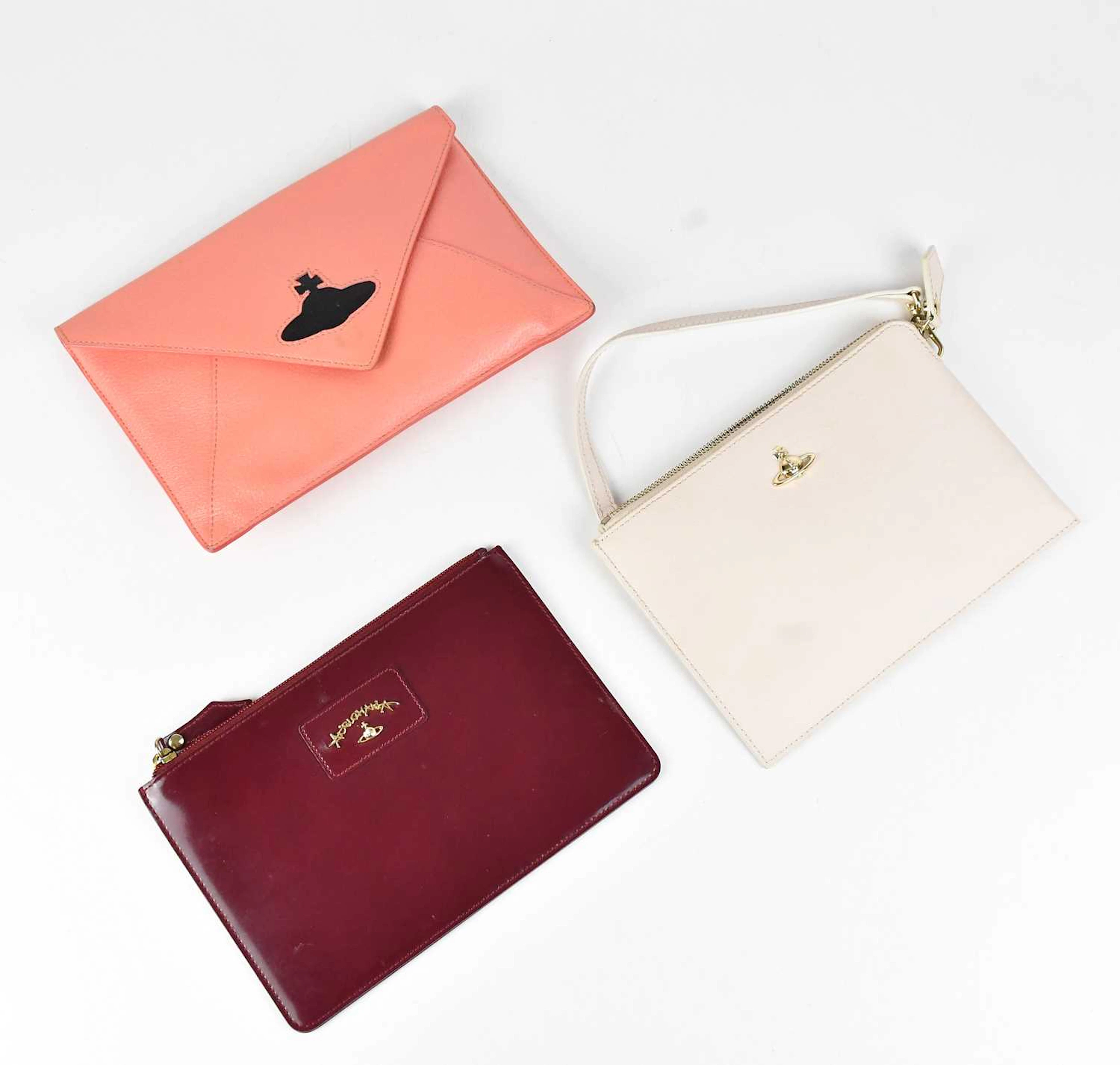 VIVIENNE WESTWOOD; a coral pebbled leather pouch with...
