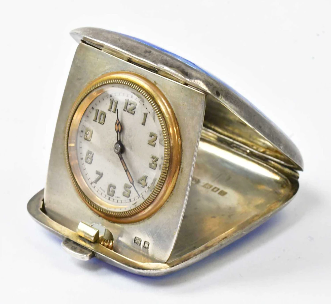 VERTEX WATCH CO LTD; a hallmarked silver miniature travel clock