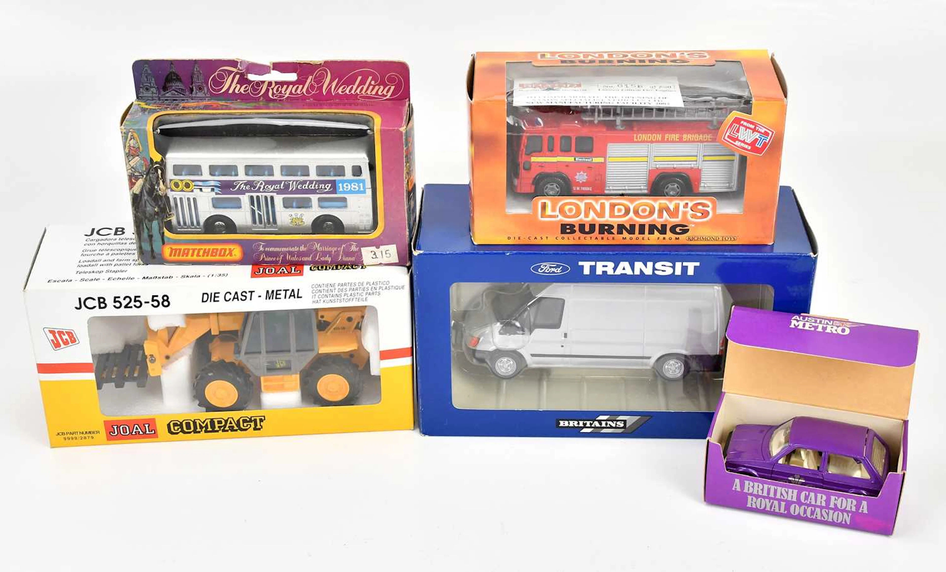 Five boxed models/diecast vehicles including a Britains...