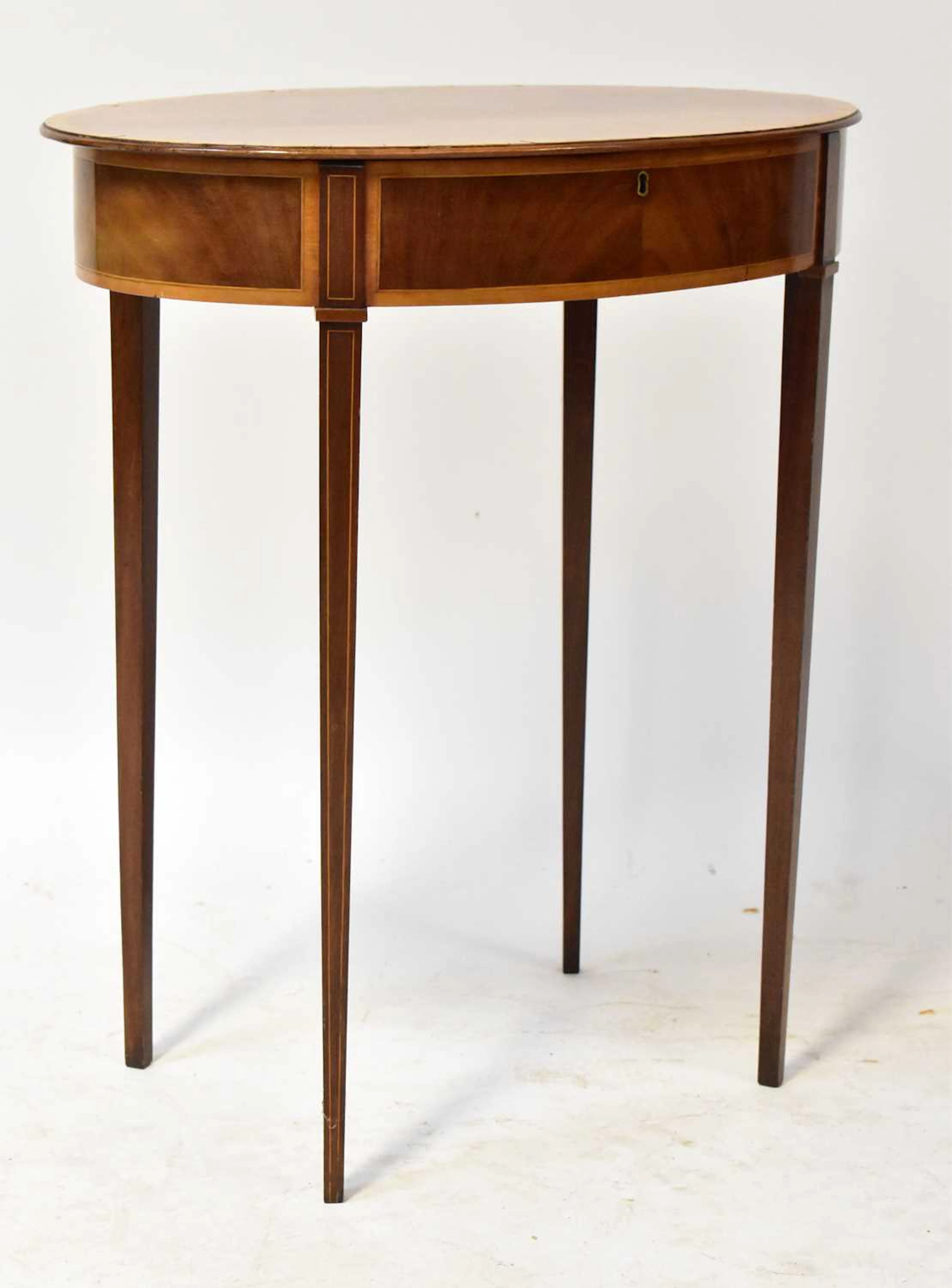 An Edwardian Sheraton-style mahogany work table