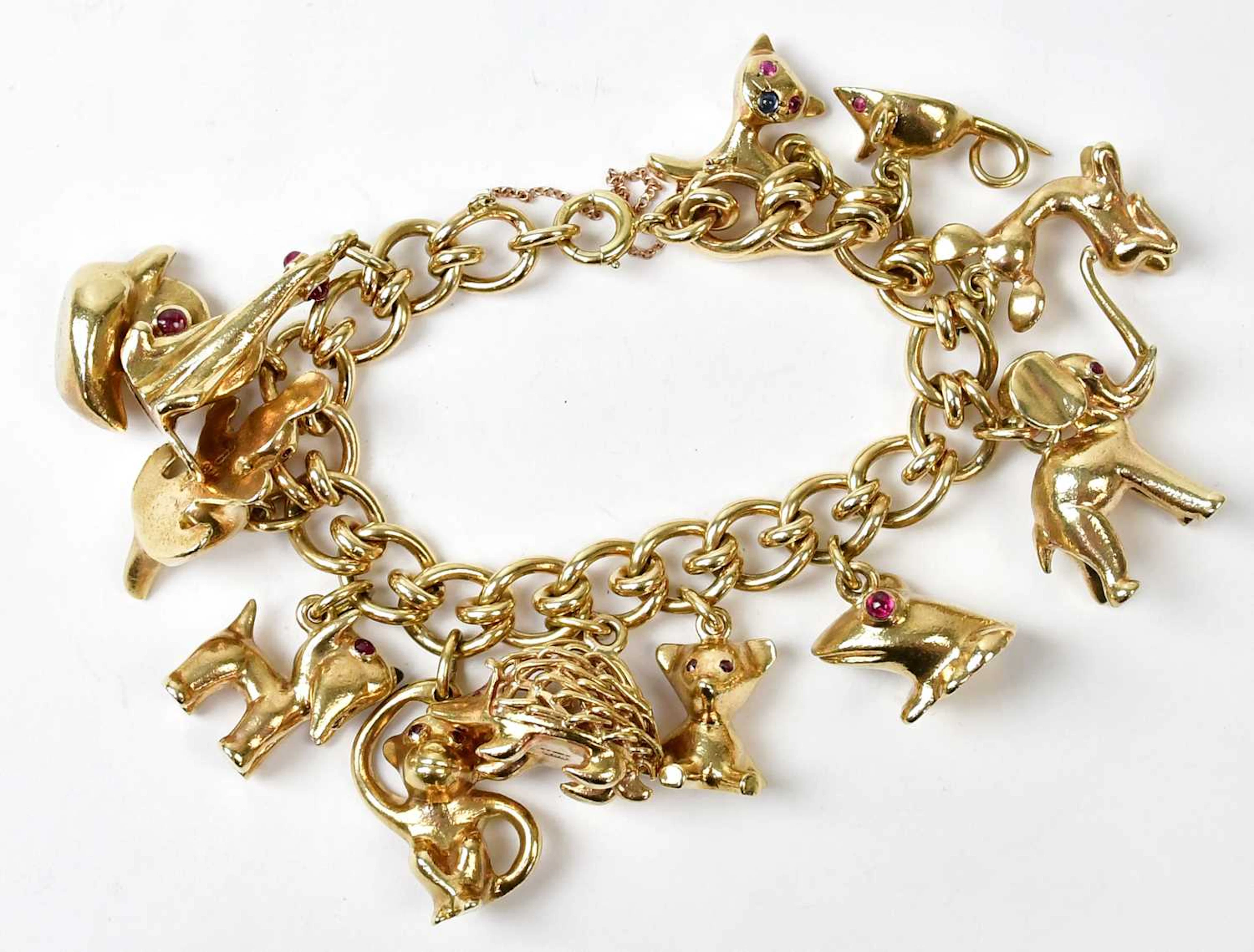 HANS GEORG MAUTNER; twelve substantial c.1960s Modernist 9ct yellow gold charms