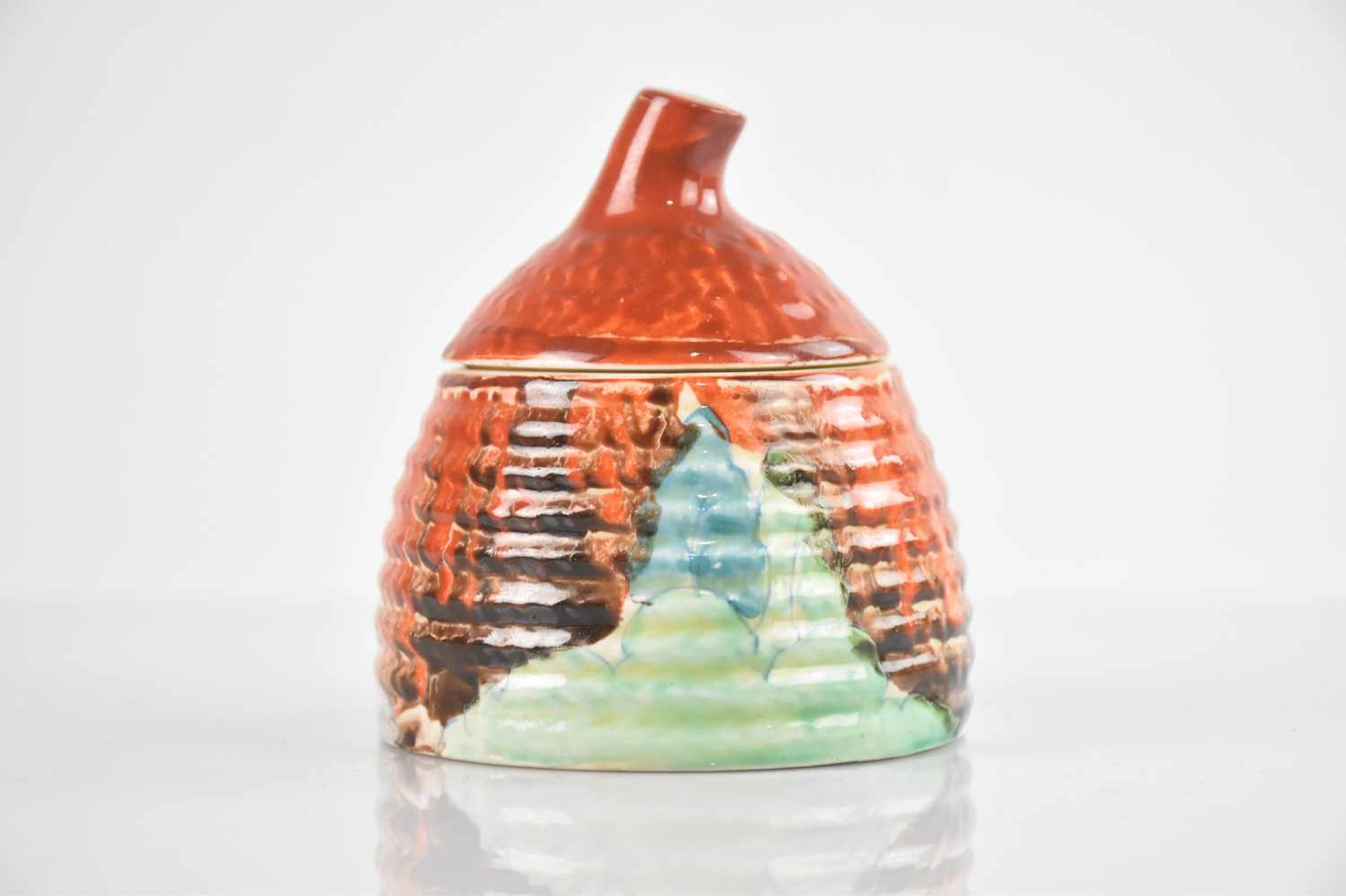 CLARICE CLIFF; a small beehive honey pot