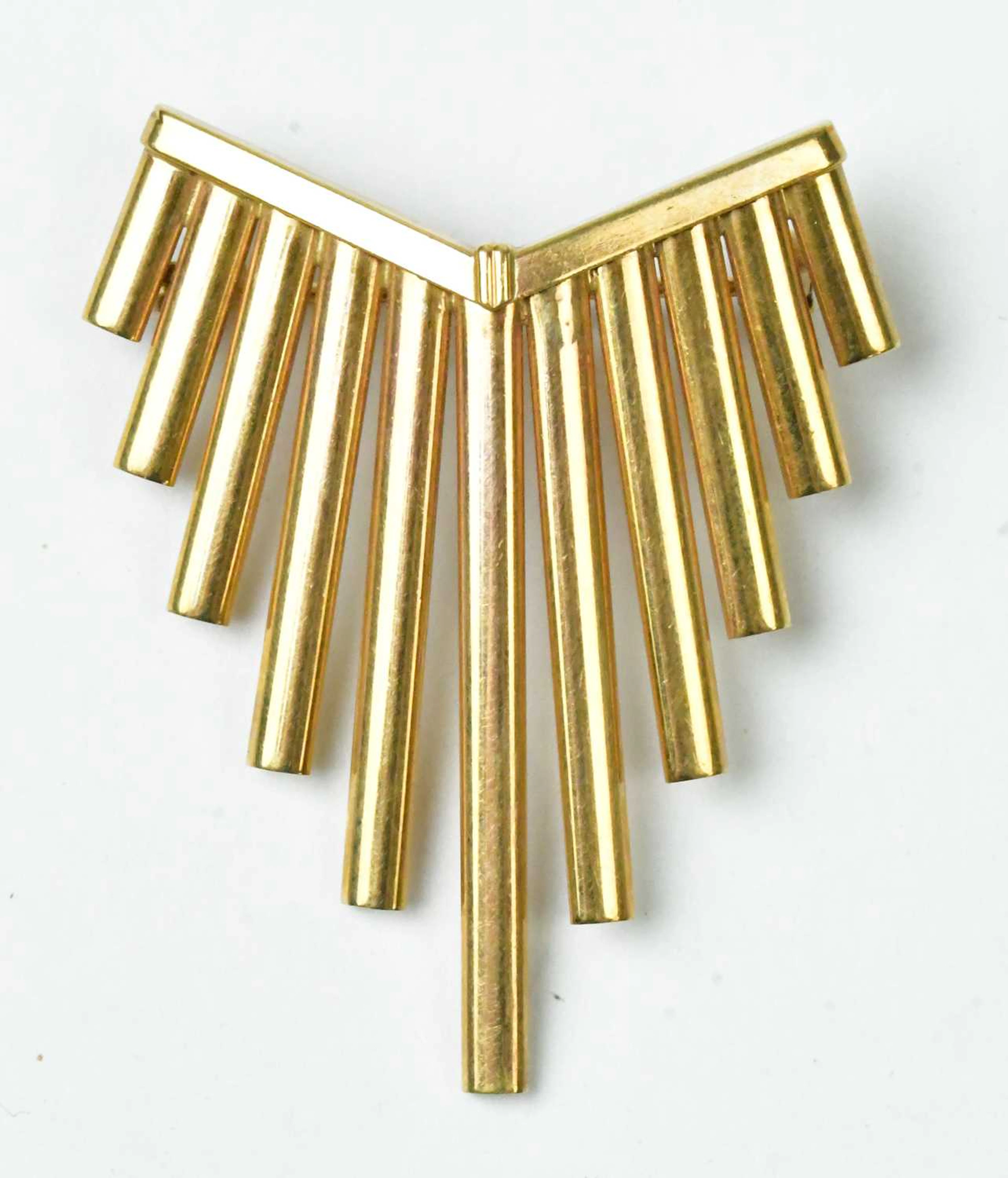 A 9ct yellow gold brooch in the form of graduated bars
