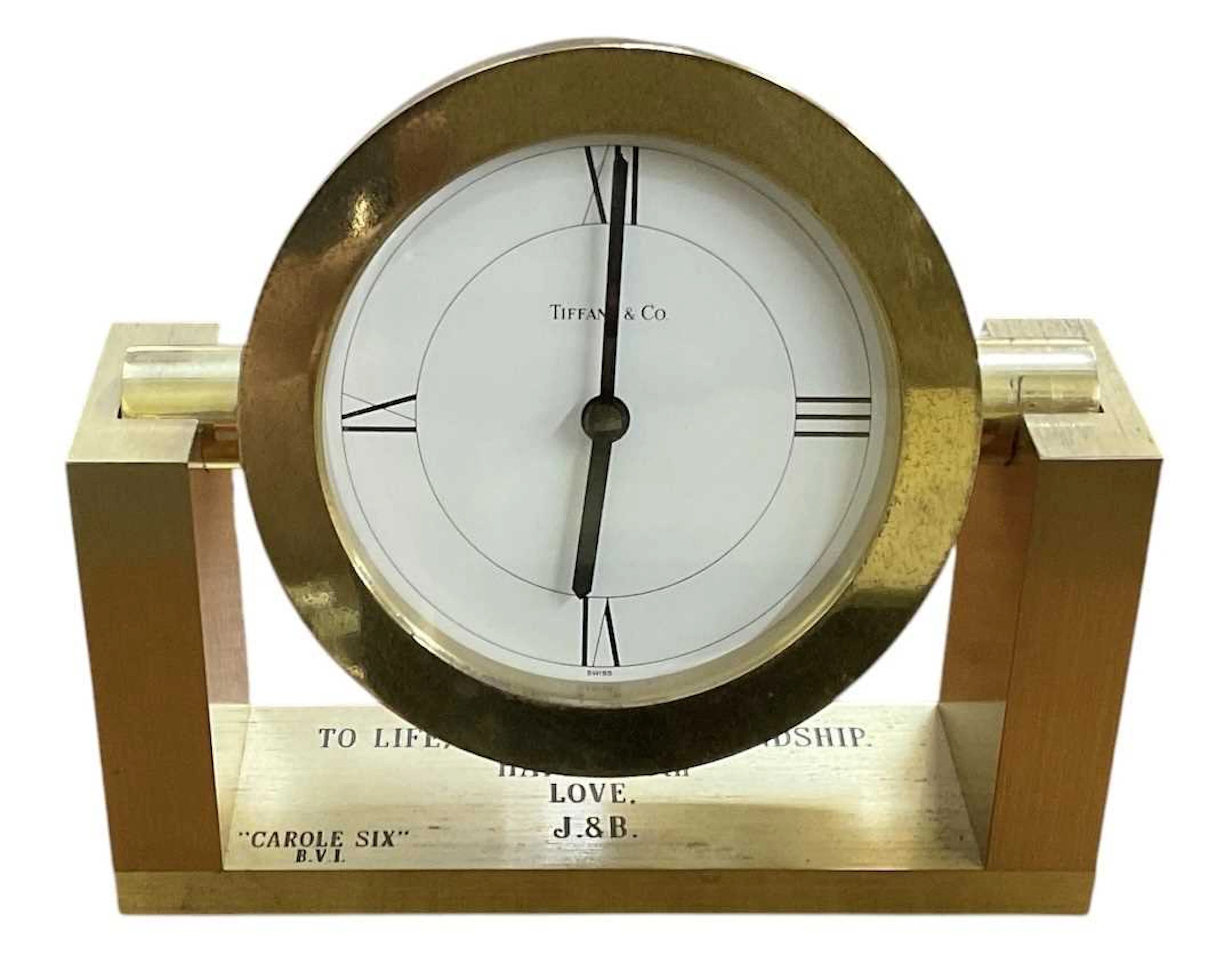 TIFFANY & CO; a gilt metal cased revolving desktop timepiece