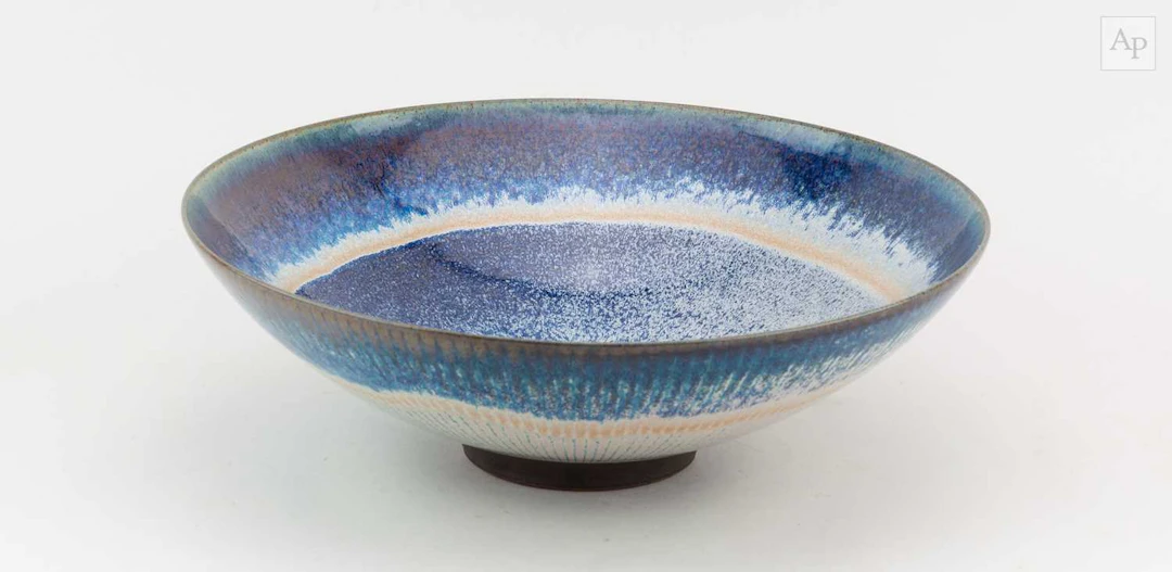 PETER SPARREY (born 1967); a large stoneware bowl covered in rutile glaze