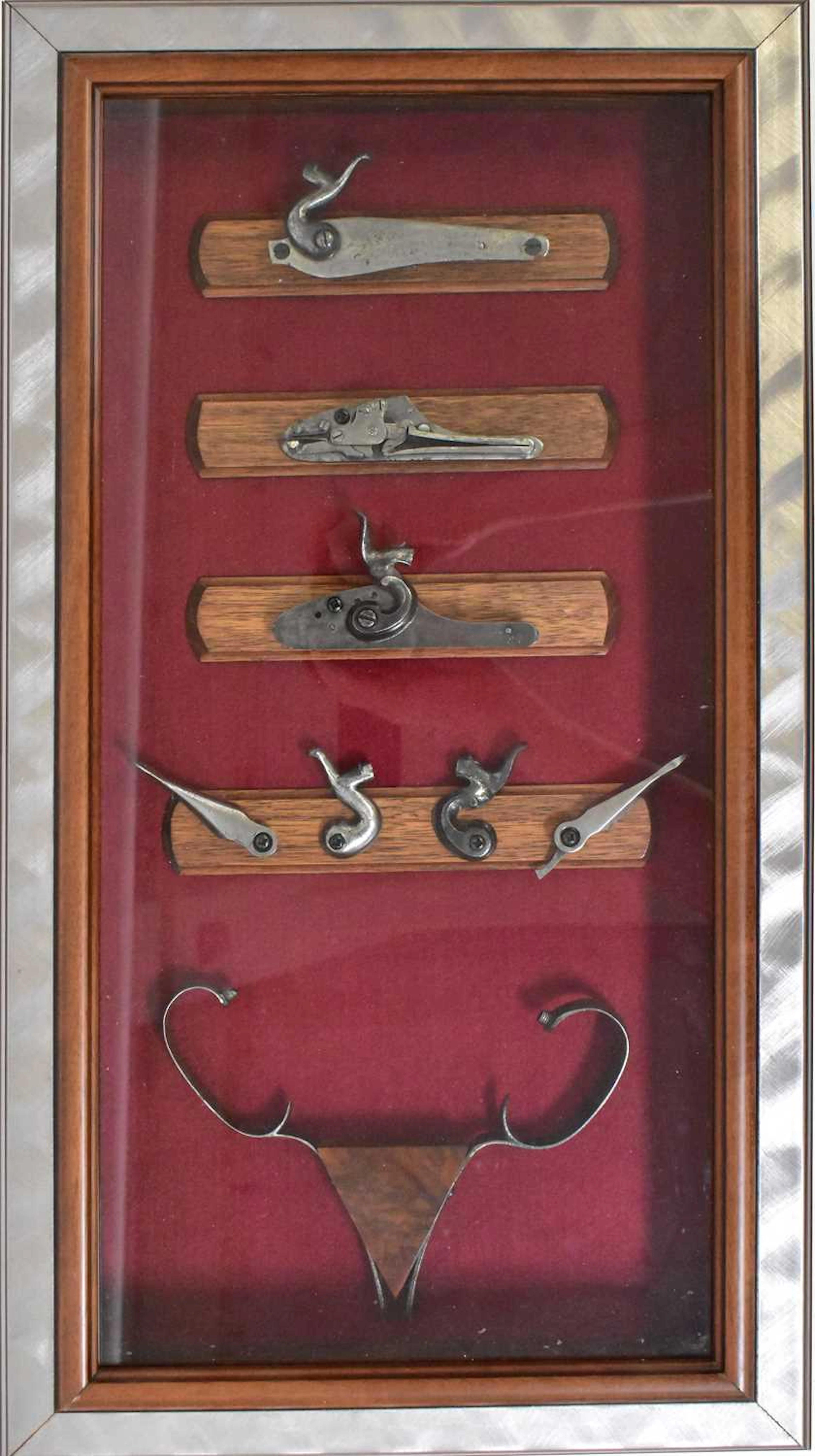 Three bespoke visual displays of antique firearm gun...