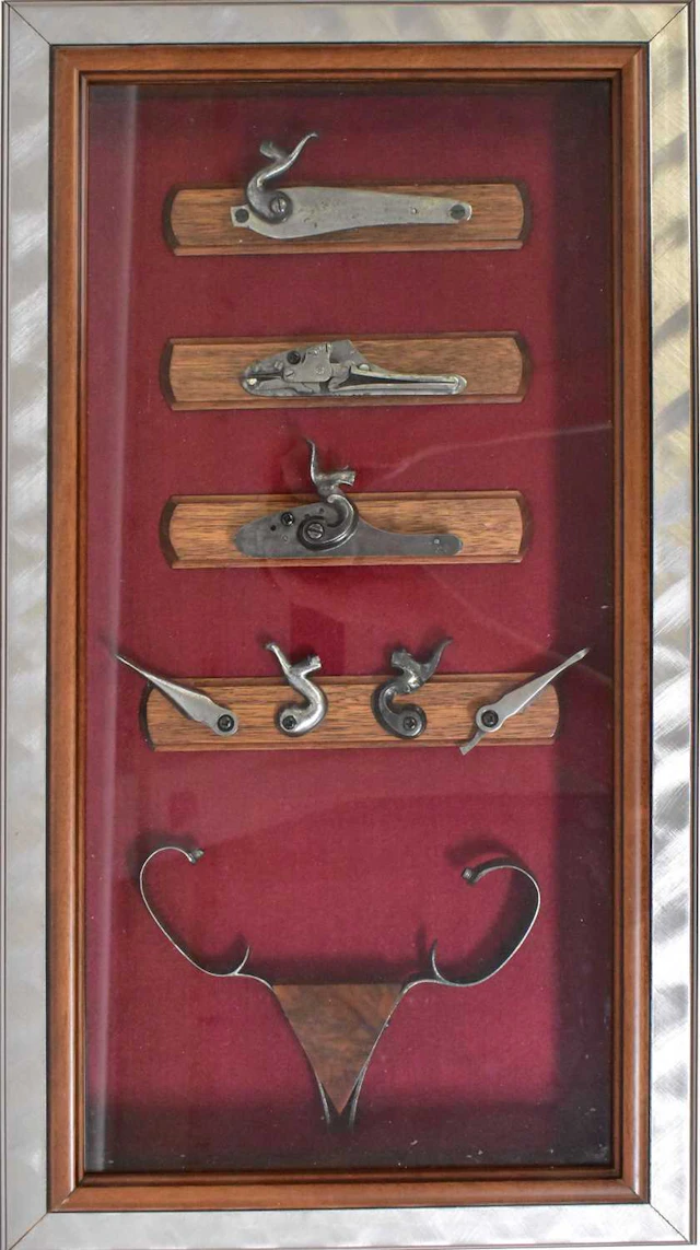 Three bespoke visual displays of antique firearm gun...