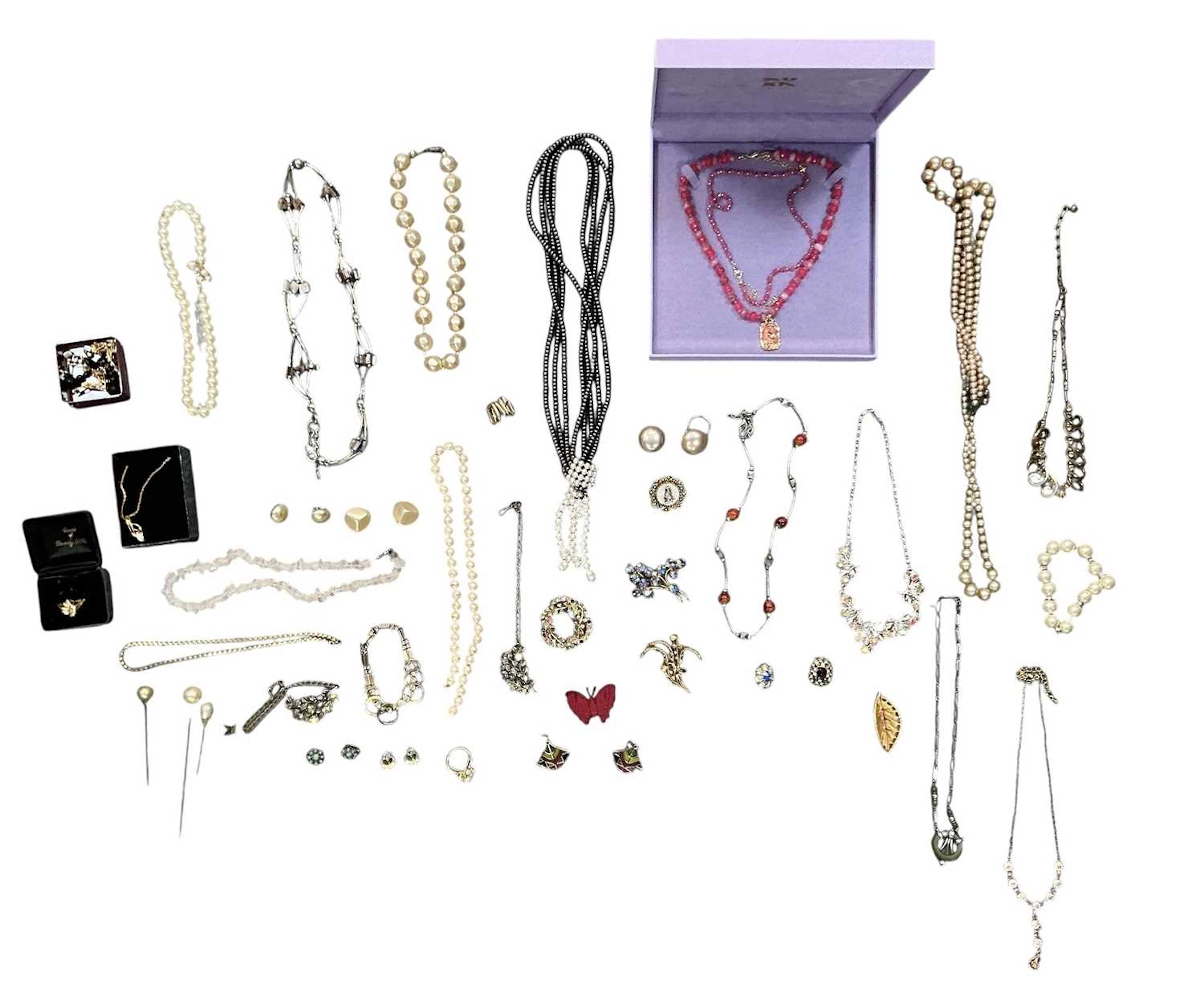 A quantity of assorted costume jewellery including a...