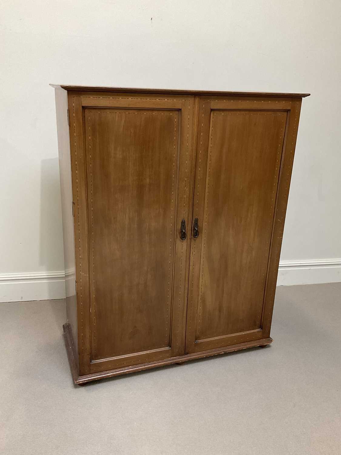 An Edwardian mahogany hall robe
