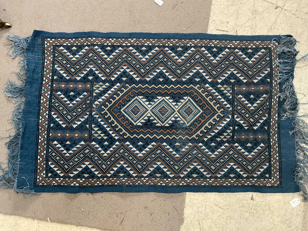 A blue ground eastern style hand knotted woollen rug