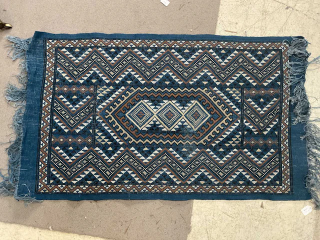 A blue ground eastern style hand knotted woollen rug