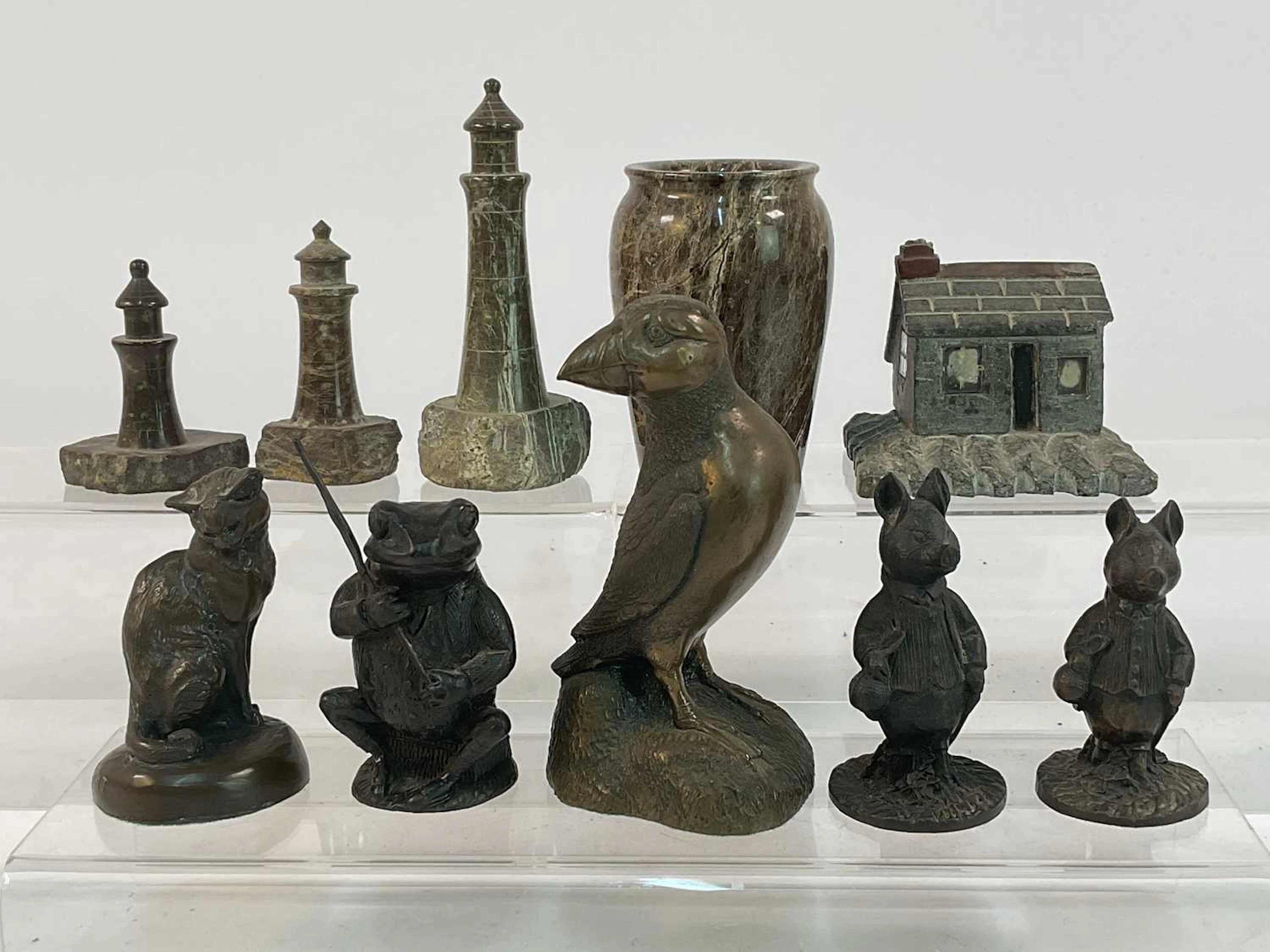 Five bronzed resin and metal sculptures of animals and character animals