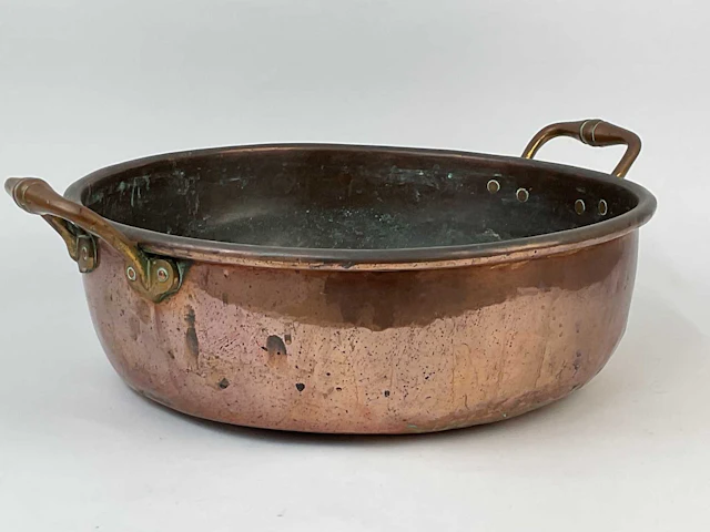 A 19th century copper jam pan with brass handles