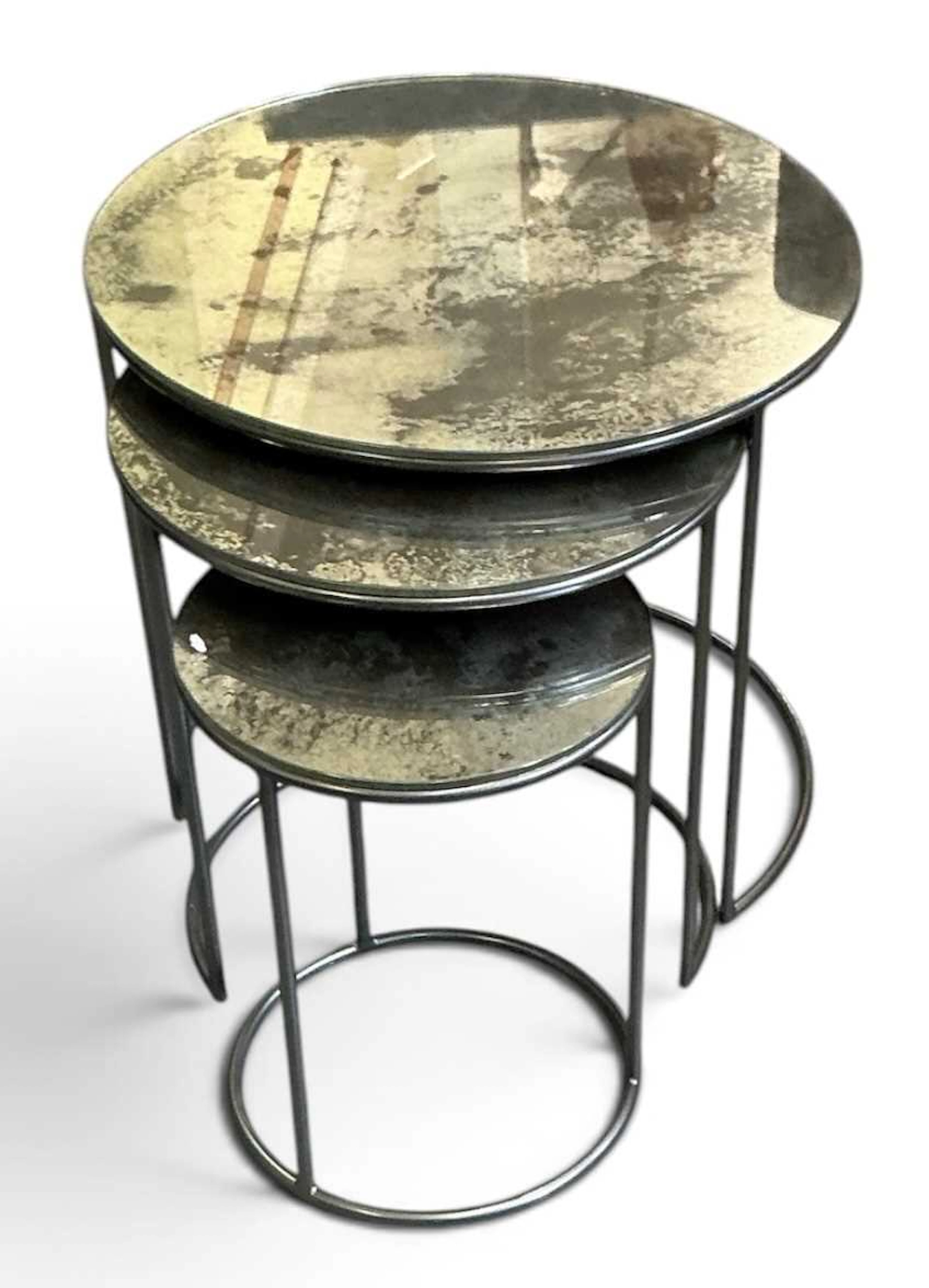 A nest of three modern contemporary chromed stainless...