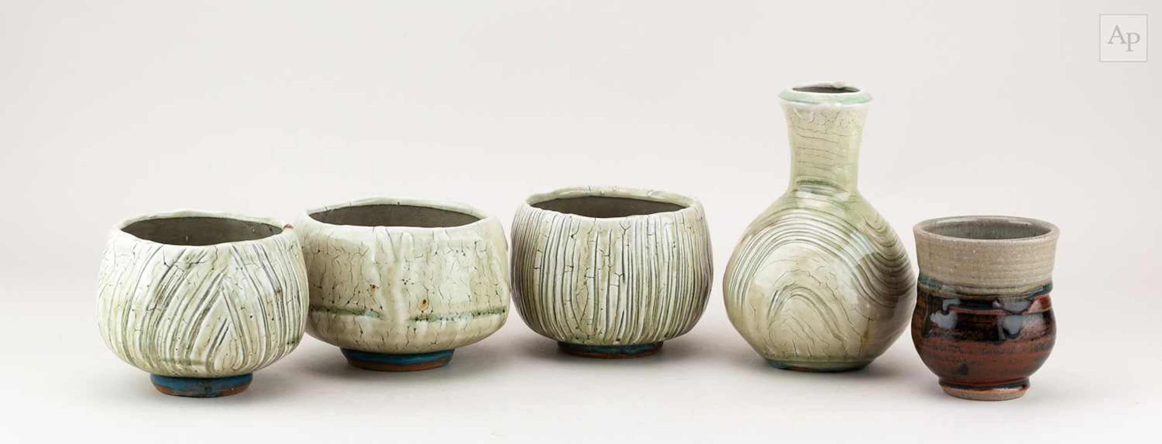 BEN DODD; a trio of stoneware chawan covered in ash glaze and biscuit slip