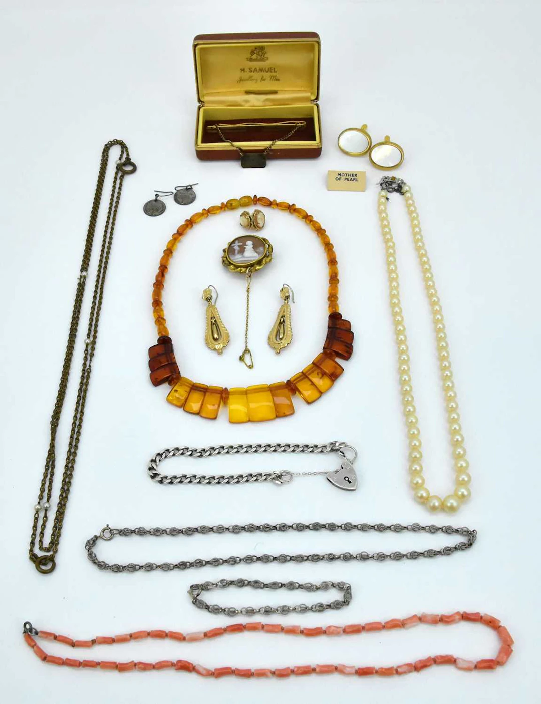 A collection of costume jewellery including an amber style necklace