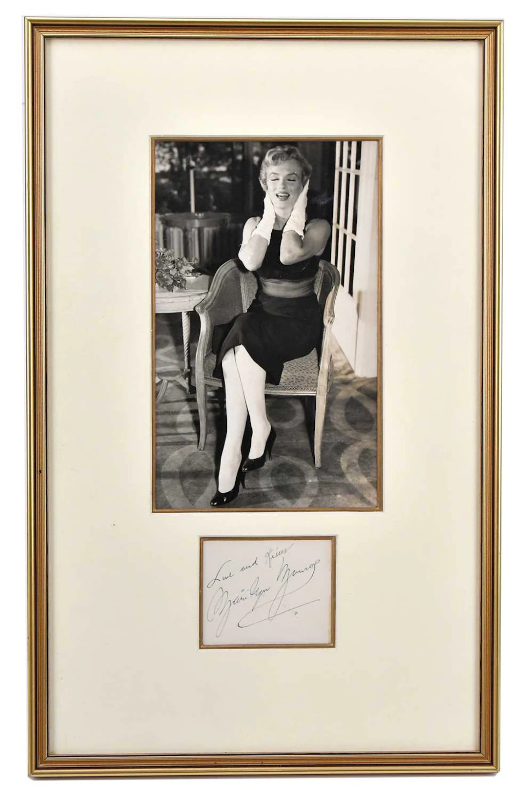 MARILYN MONROE; a black and white photograph with a signed note ‘Love and Kisses