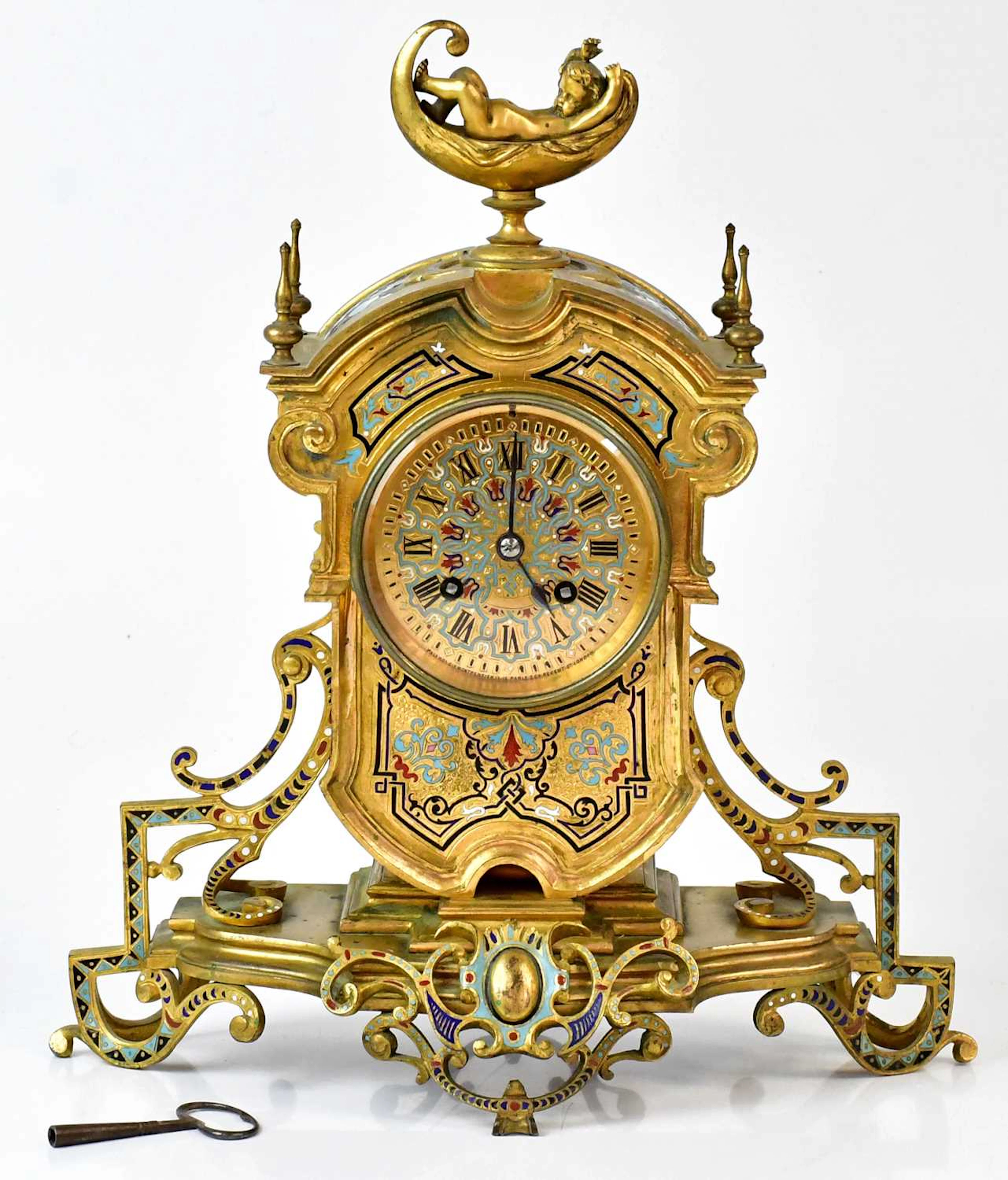 A 19th century French gilt brass mantel clock inlaid with enamelled panels