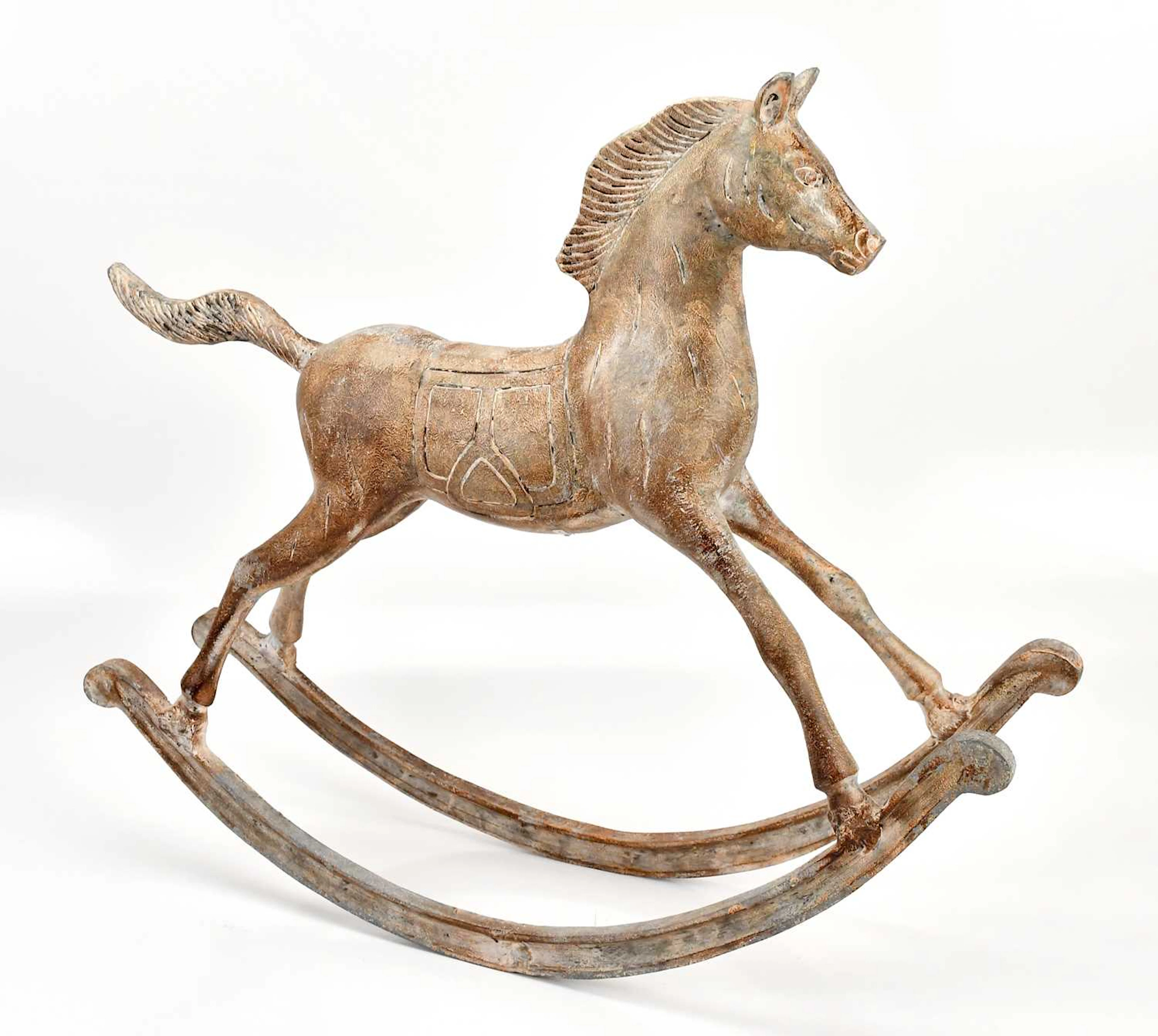 A decorative metal model of a rocking horse