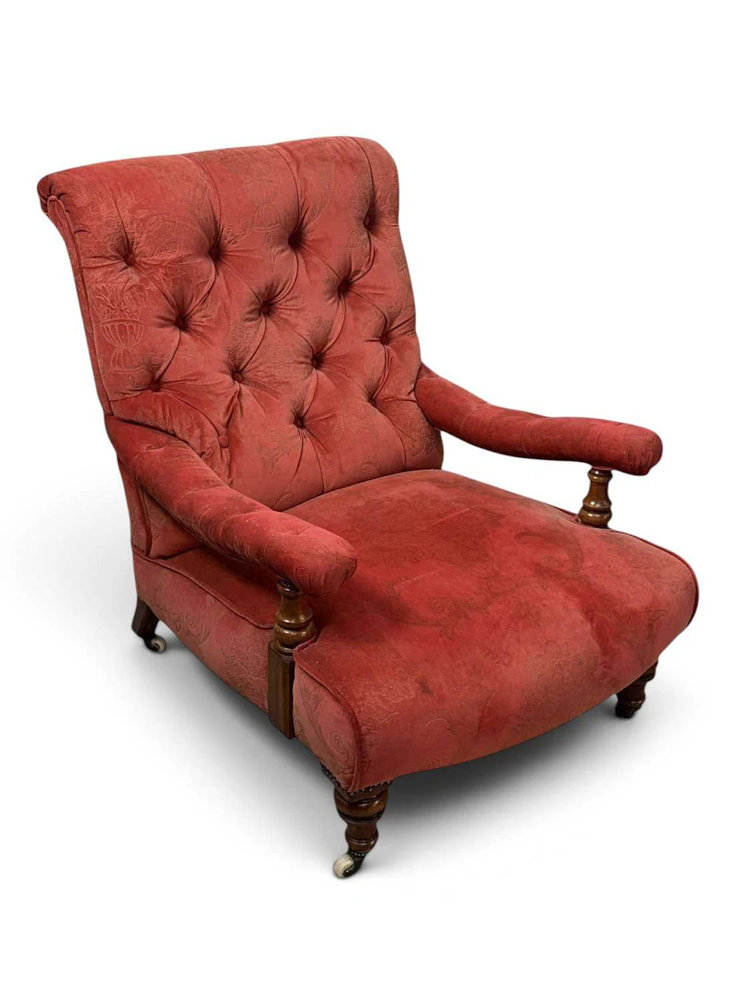A Victorian walnut library chair in the manner of Howard & Sons