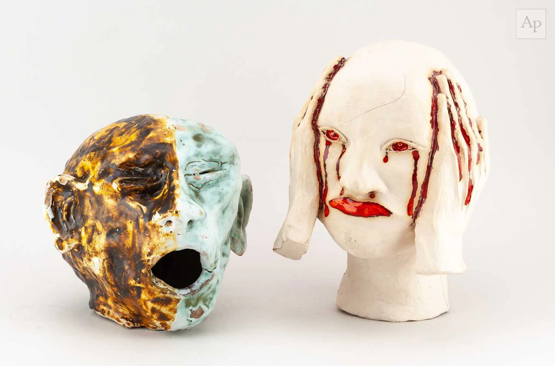 Two stoneware sculptures of heads