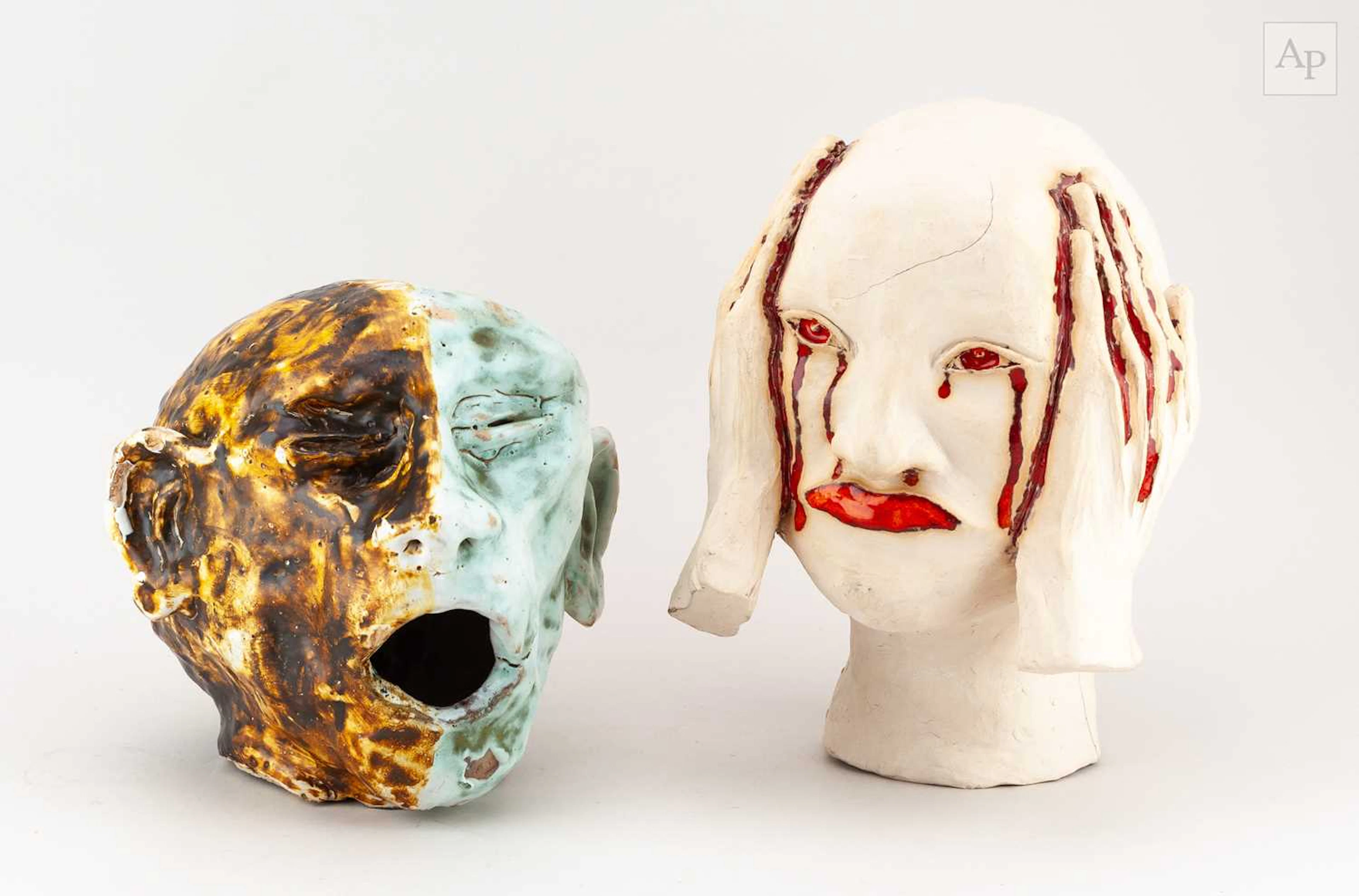 Two stoneware sculptures of heads