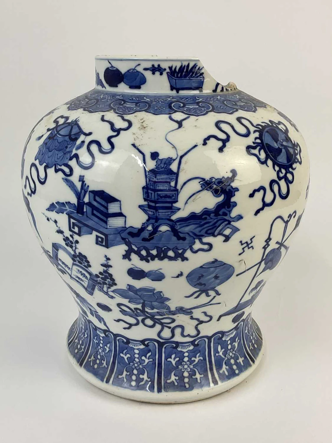 A Chinese porcelain bulbous body vase decorated with various Chinese objects
