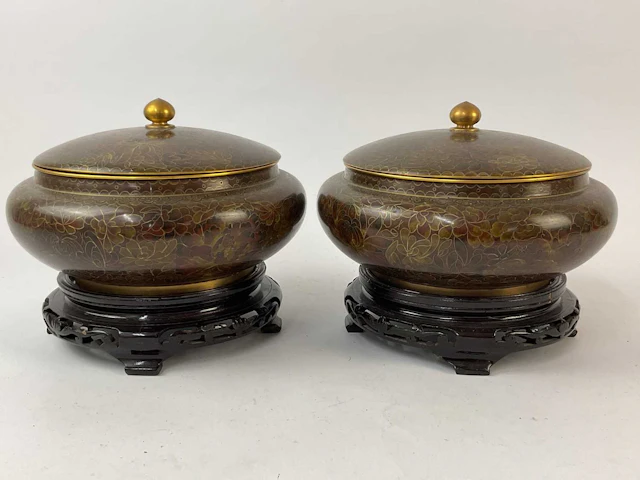 A pair of Chinese cloisonné lidded bowls with floral...