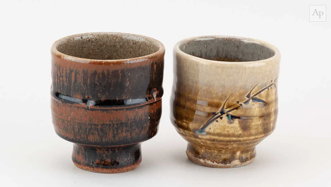 JIM MALONE (born 1946); a stoneware yunomi covered in...