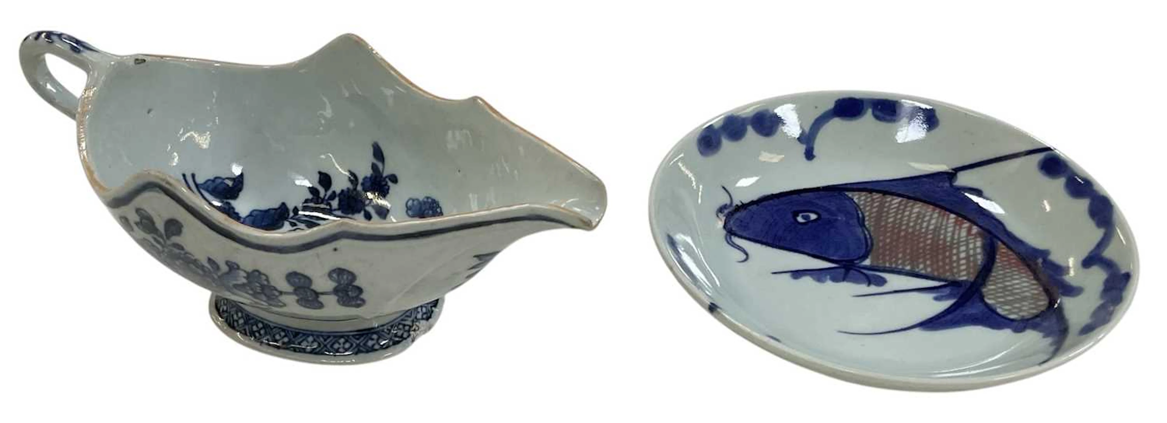 An 18th/19th century Dutch blue and white Delftware tin glazed sauceboat