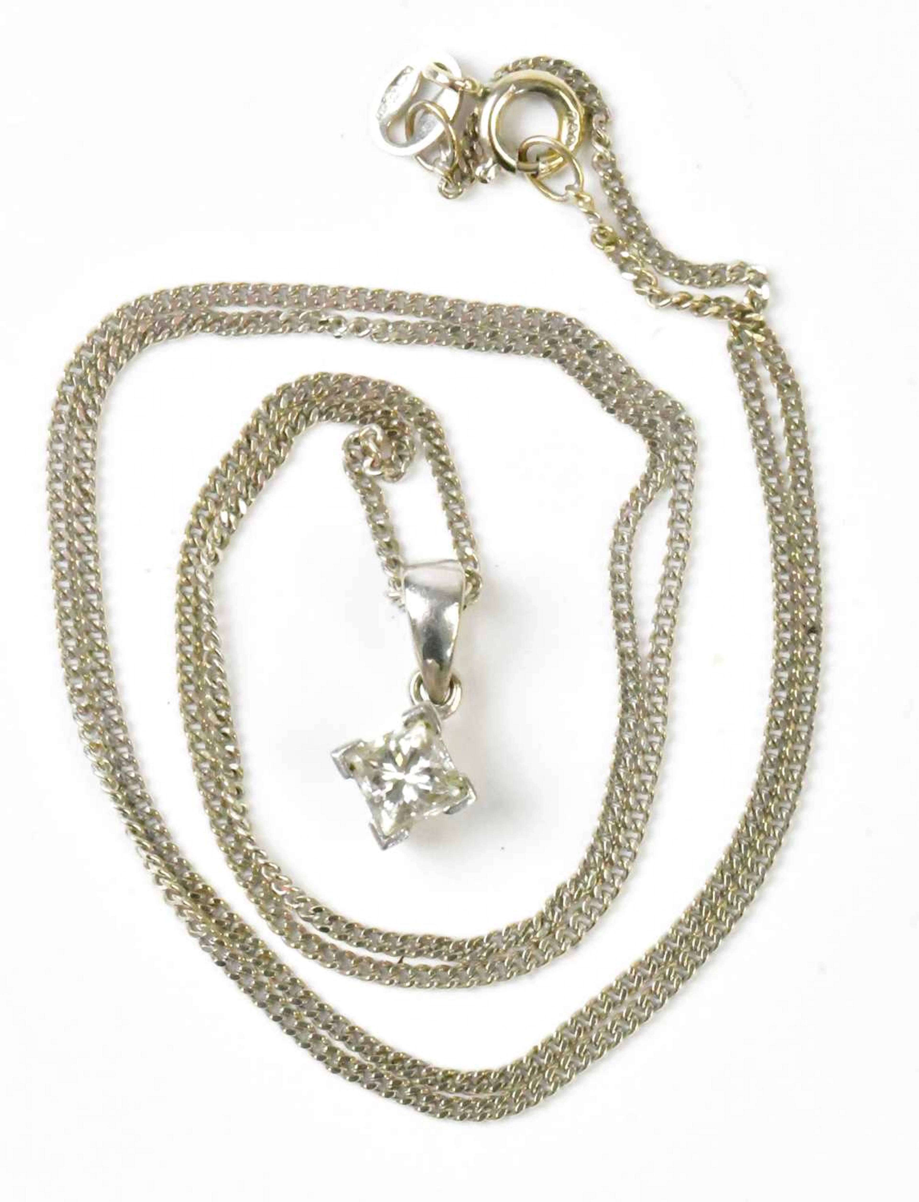 An 18ct white gold pendant set with a single princess cut diamond