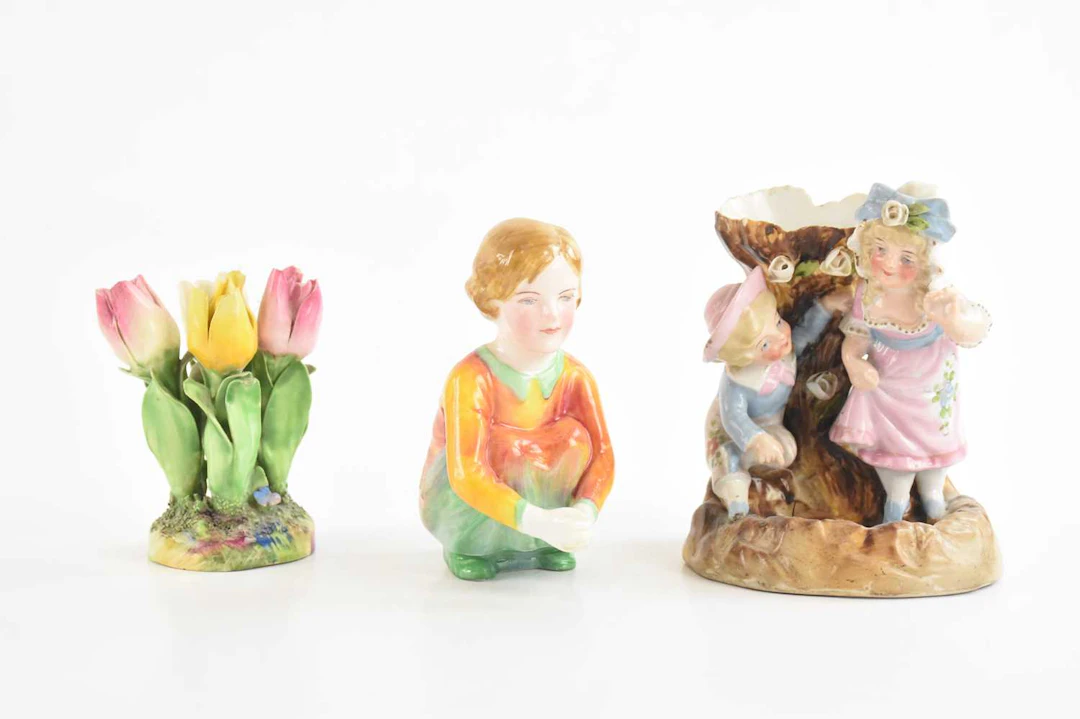 A Continental porcelain figural spill vase